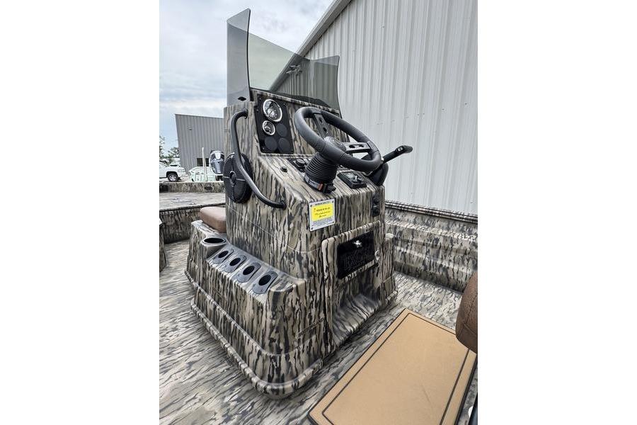 2027 Excel 230 Bay Pro Elite boat console with camouflage design and steering wheel.