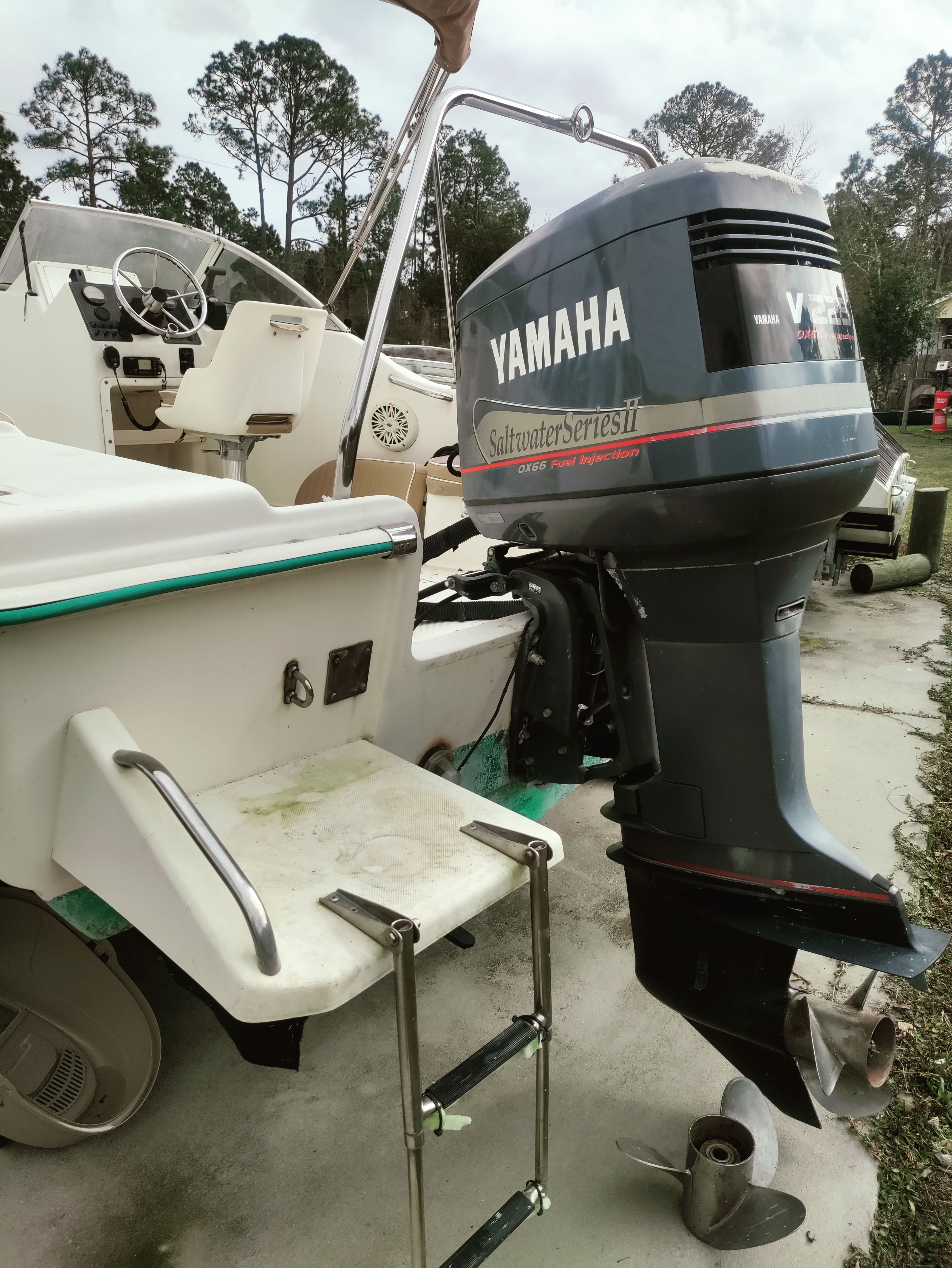 A 2000 Scout 202 boat with a Yamaha outboard motor, parked on a trailer.