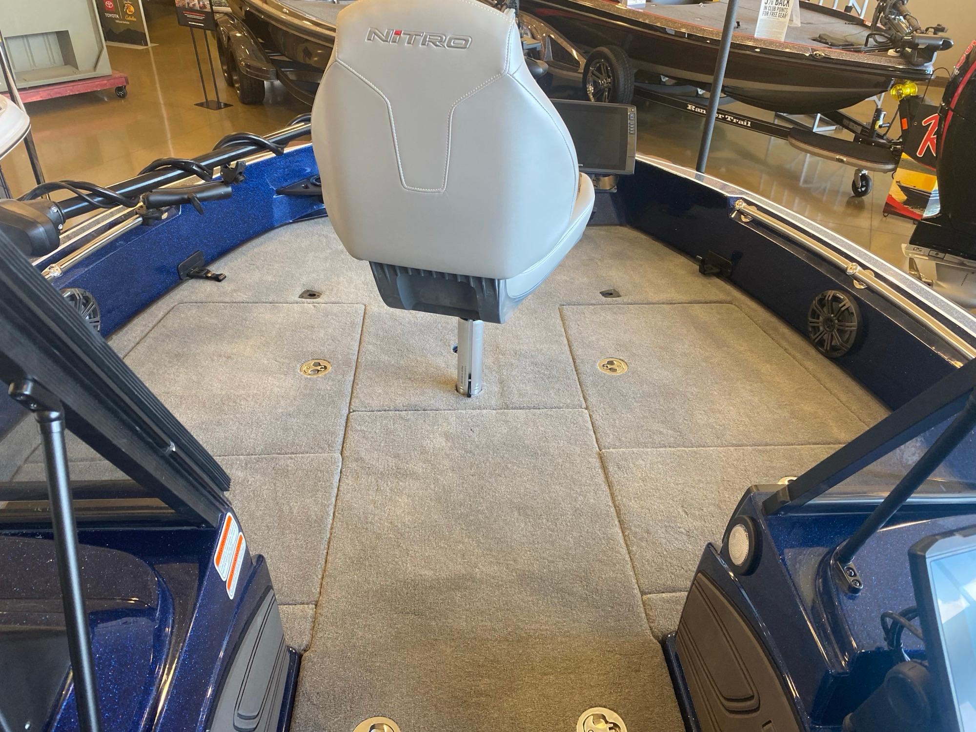 2025 Nitro ZV20 Pro boat interior with gray seating and carpeted deck.