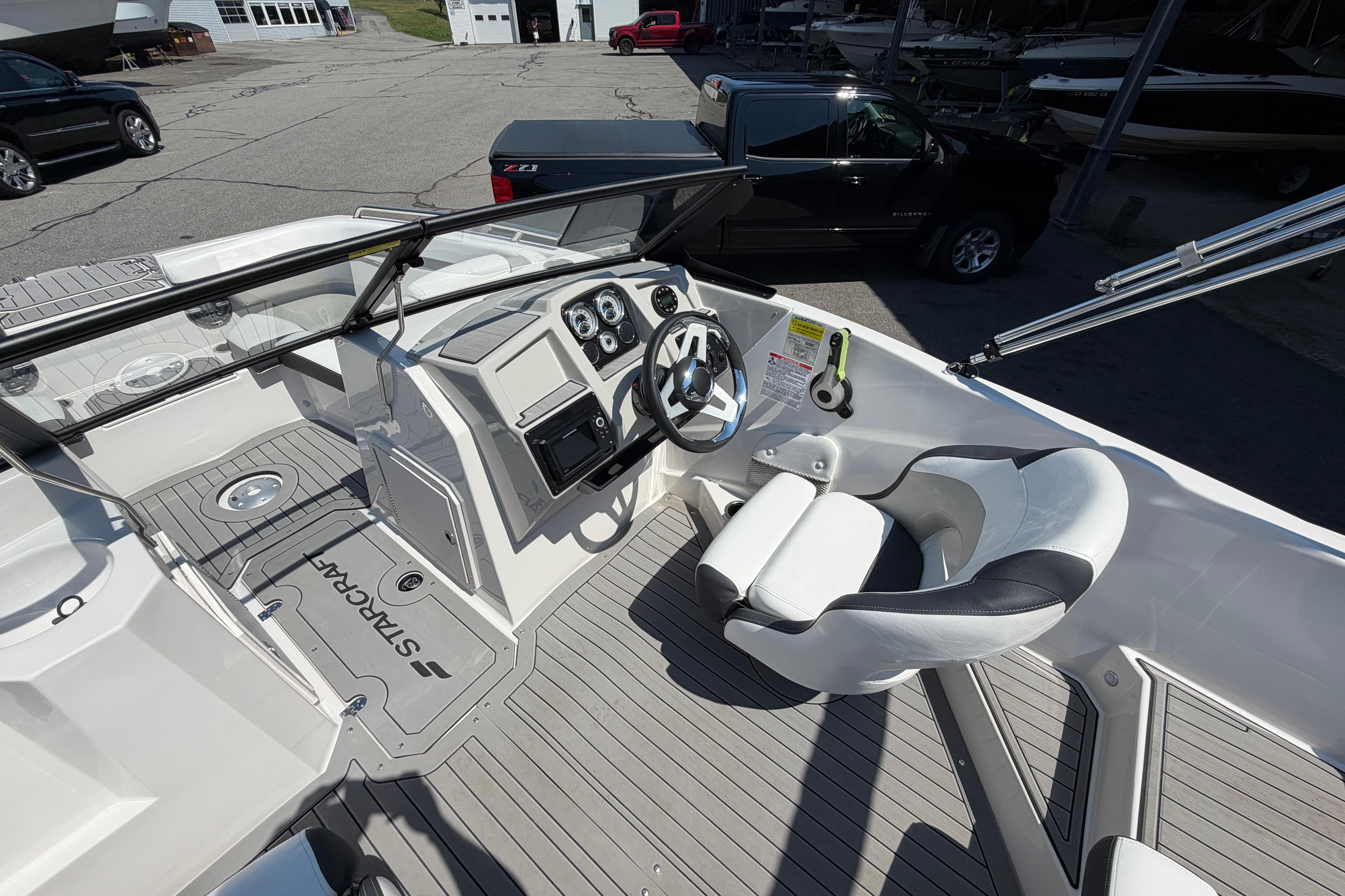 2025 Starcraft SVX 190 OB boat interior with steering wheel and seating.