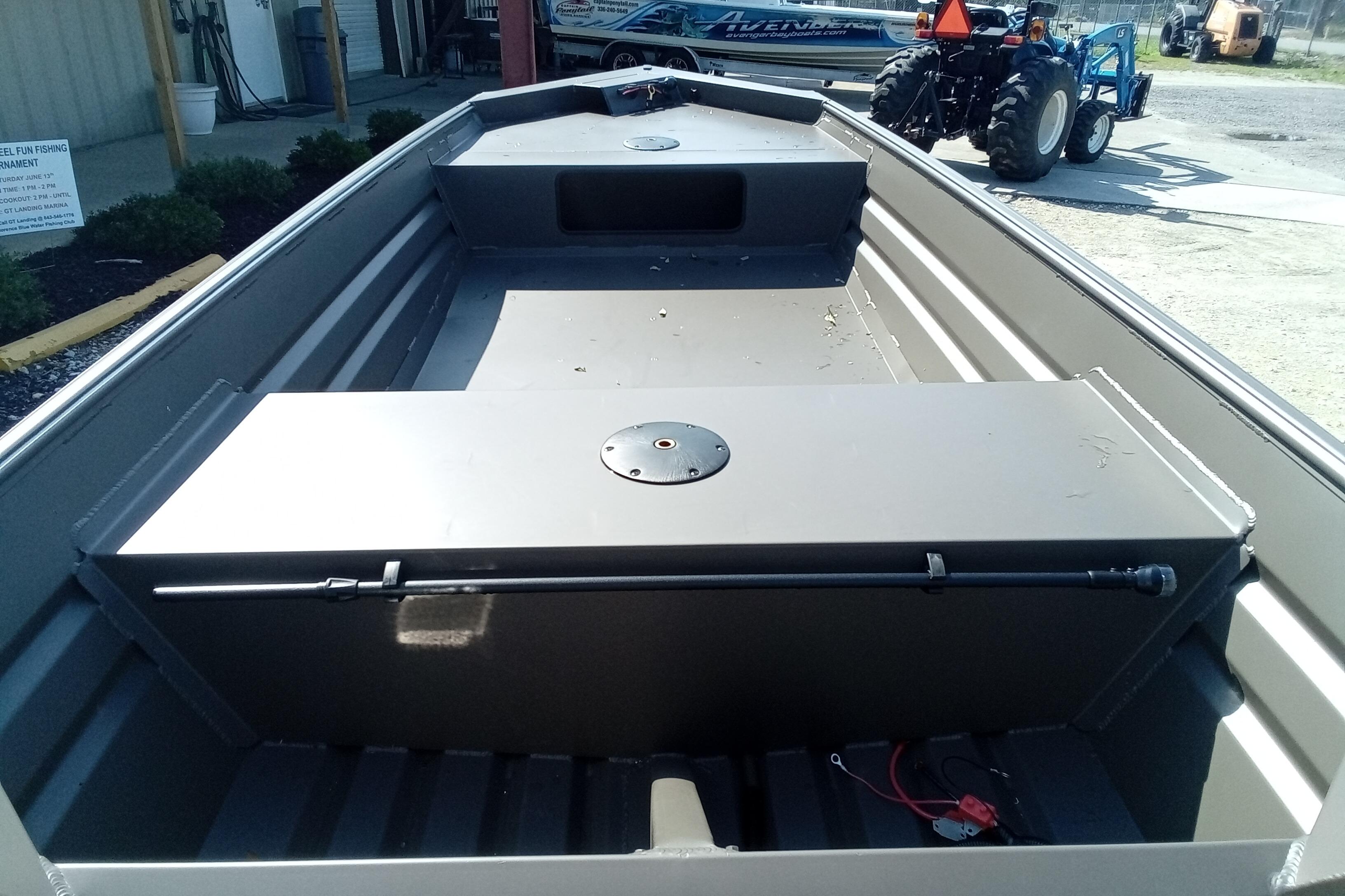 2026 Alweld 1448VV Vee Bottom boat interior with storage compartments and seating.