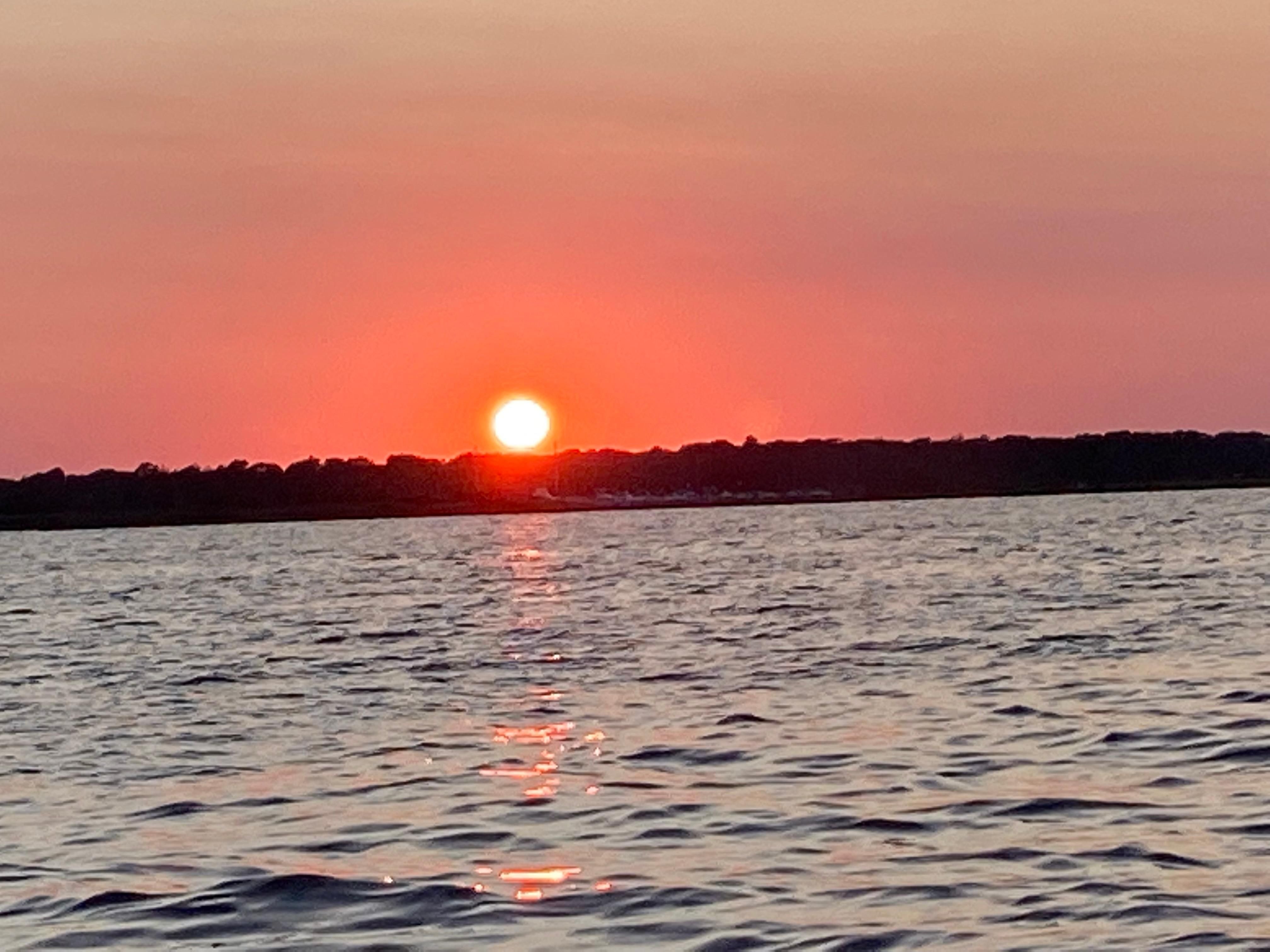 Sunset over the sea, captured from a Sailfish 276 DC boat.