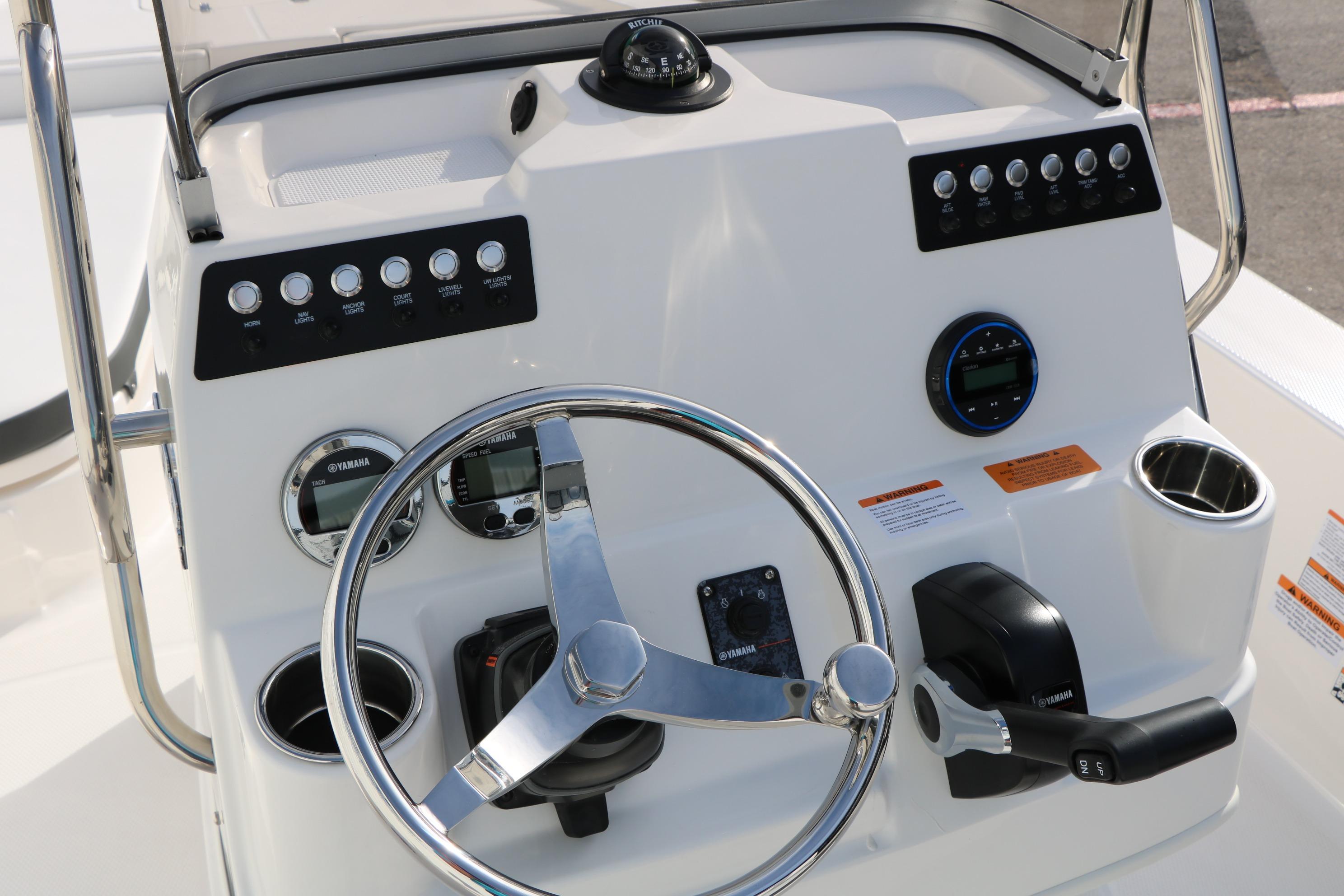 2026 Robalo 206 Cayman boat dashboard with steering wheel and control panel.
