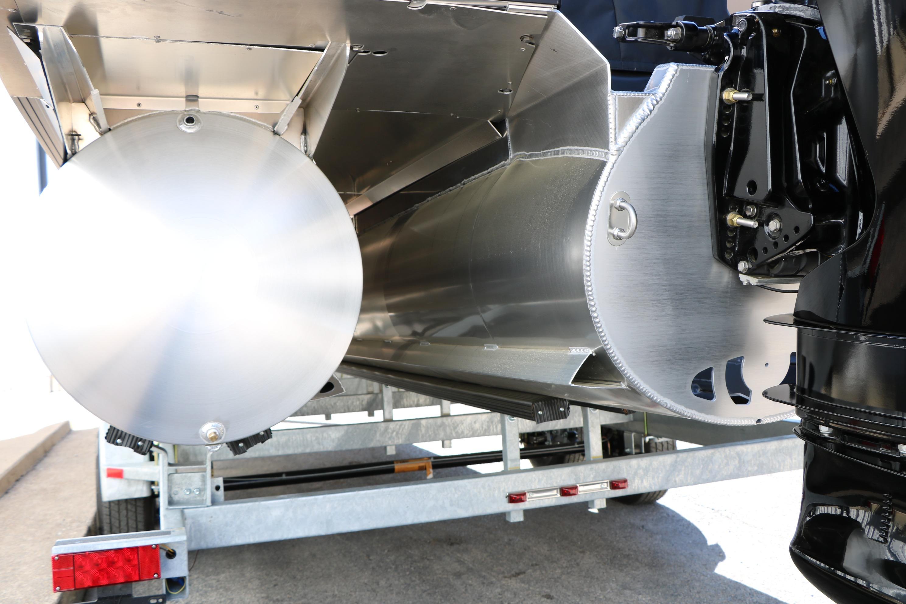 2026 Evotti 525 QL Tri-Toon pontoon boat underside on trailer.