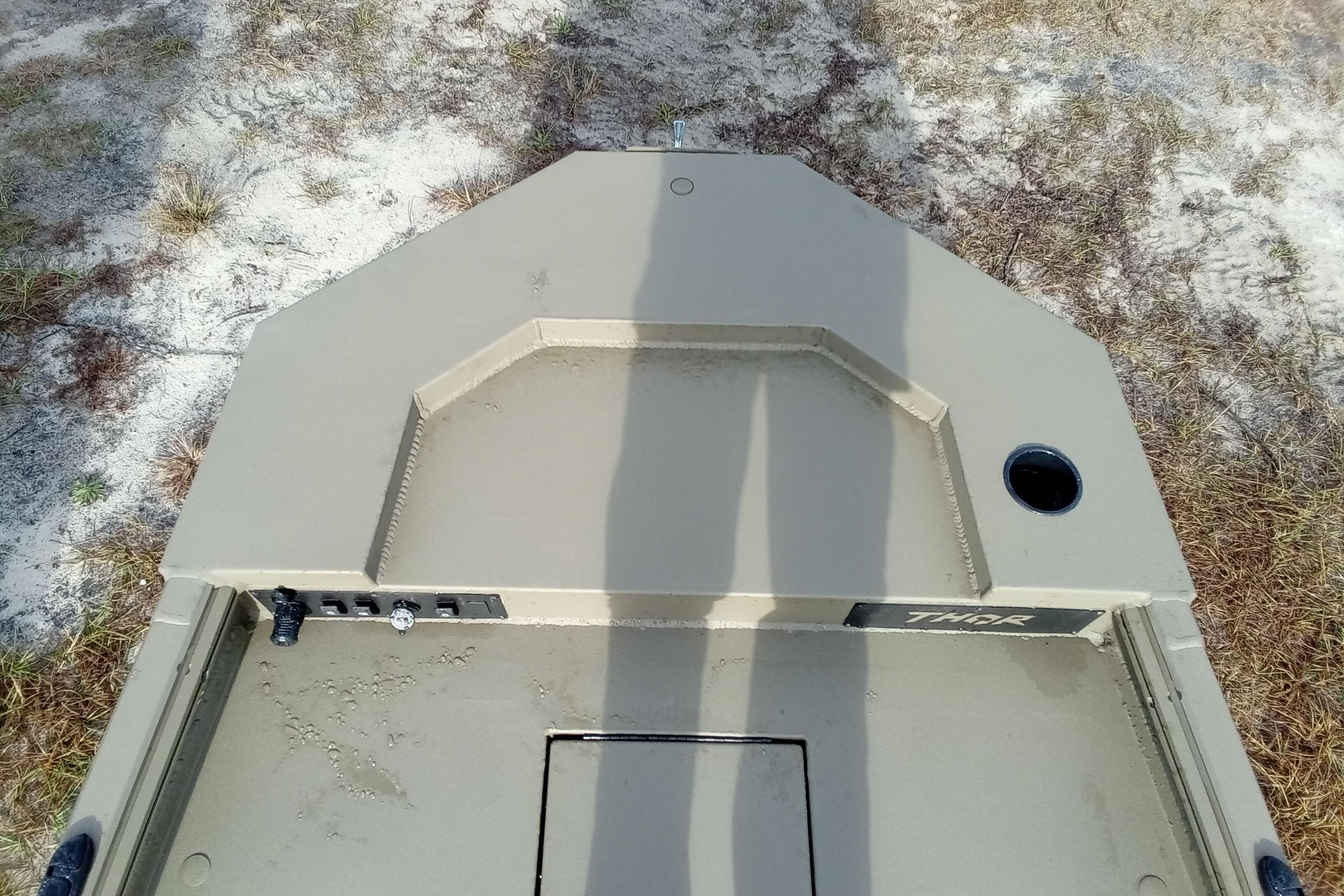 Top view of 2026 Thor 1754 Swamp Hammer boat on sandy terrain.