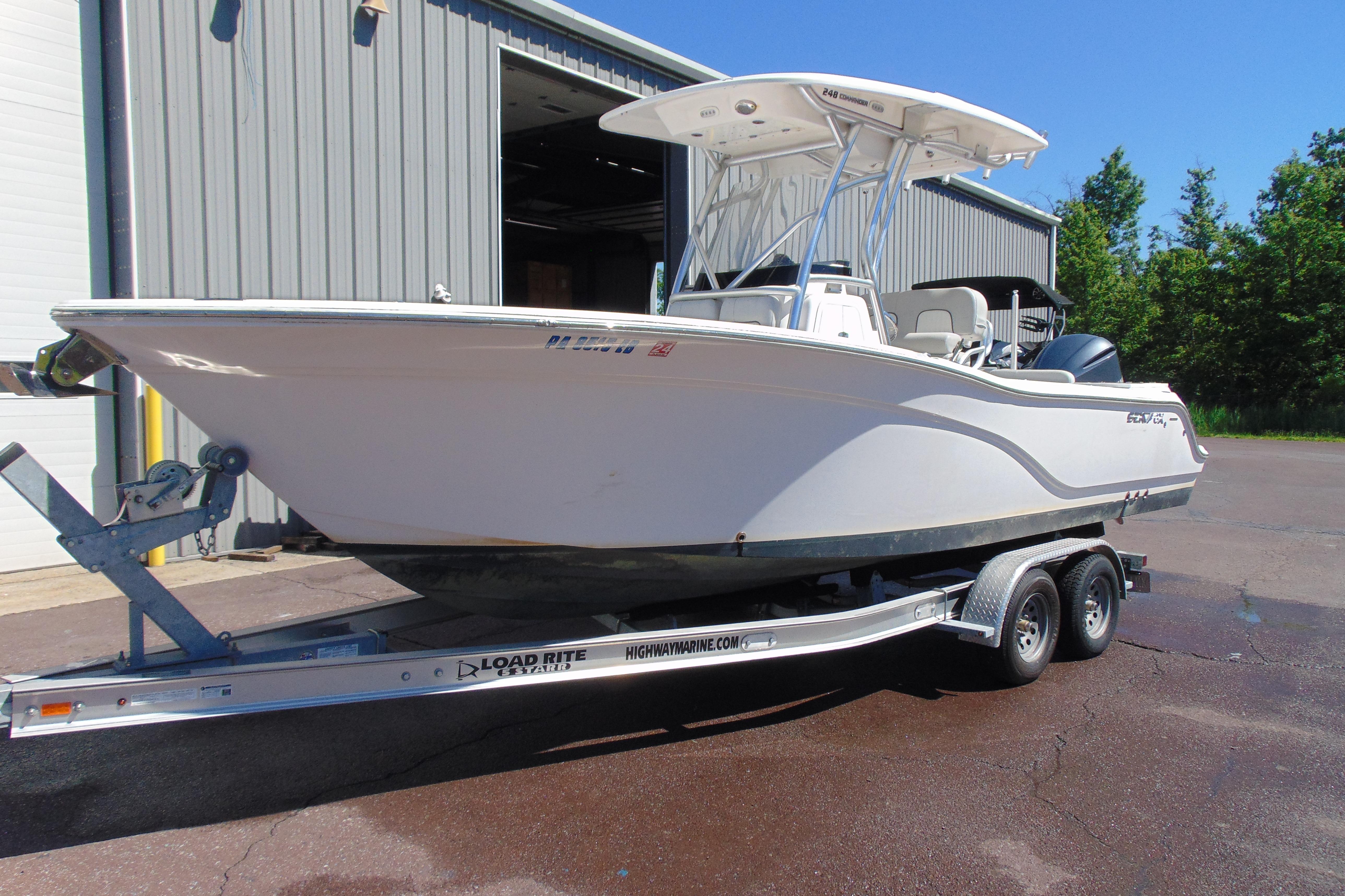 2022 Sea Fox 248 Commander boat on trailer outside a warehouse.