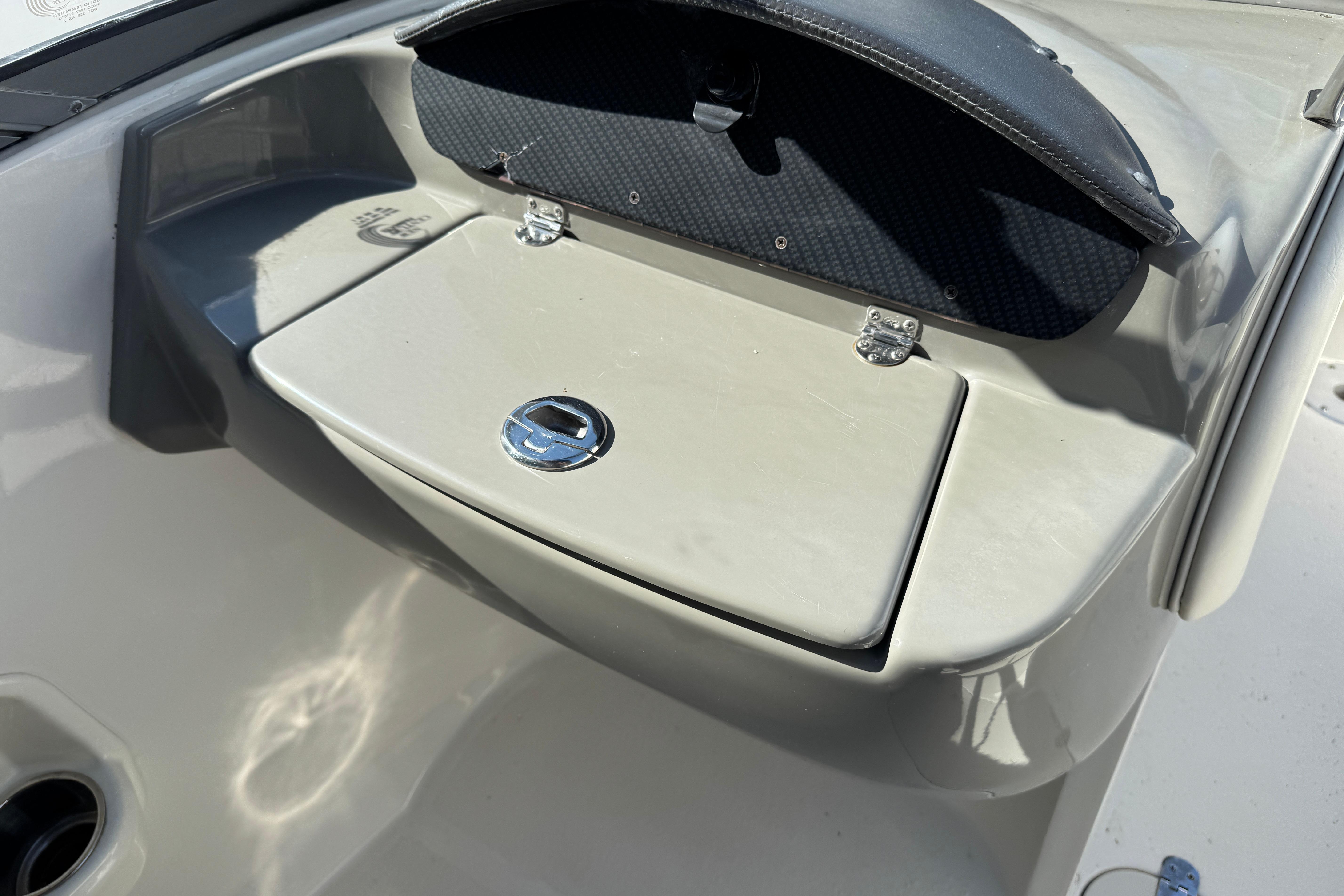 2018 Stingray 204 LR boat dashboard with storage compartment and latch.