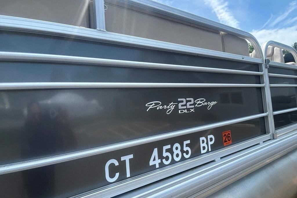 2023 Sun Tracker Party Barge 22 DLX pontoon boat with registration number CT 4585 BP.