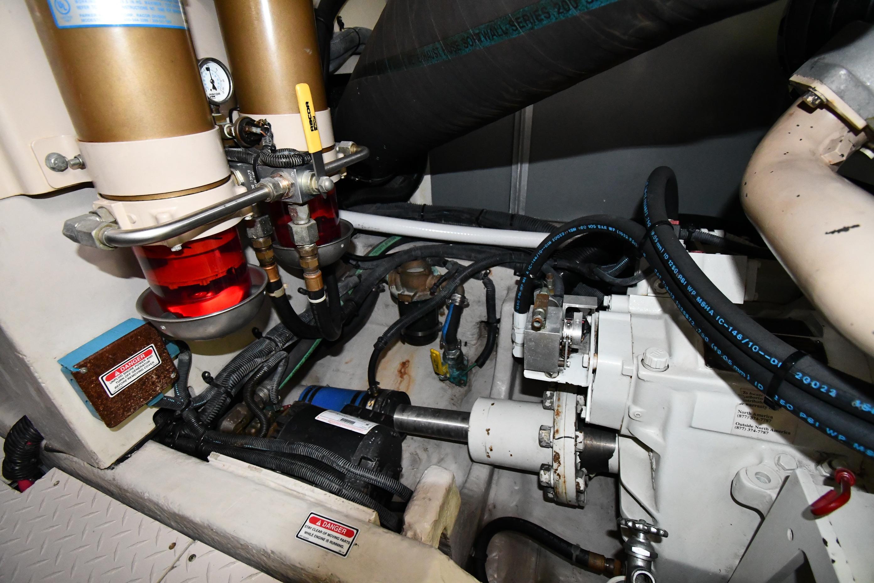 Engine room of 2001 Sea Ray 540 Sundancer with visible components and hoses.