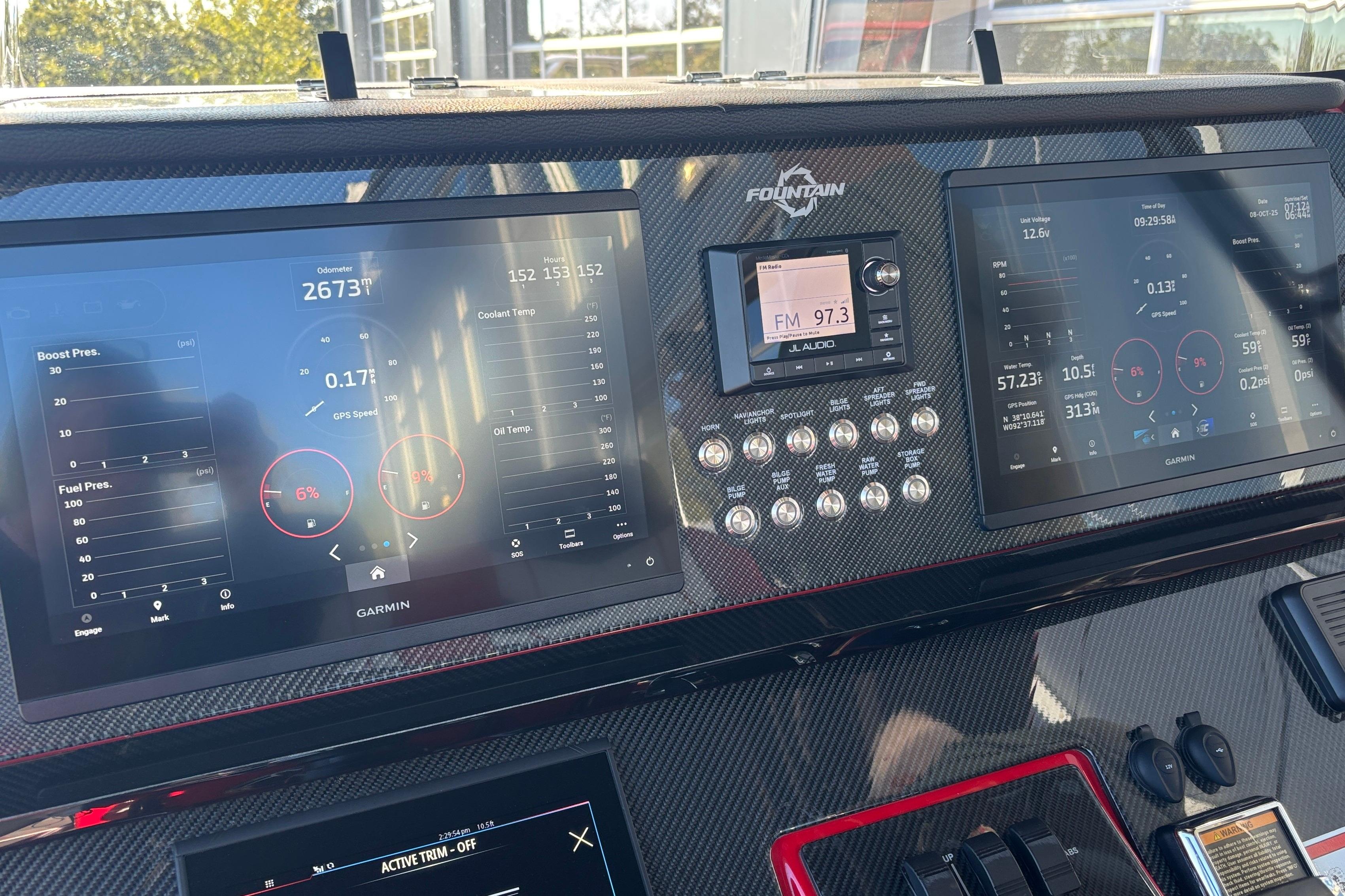 Dashboard of 2021 Fountain 38 SC boat with Garmin displays and controls.
