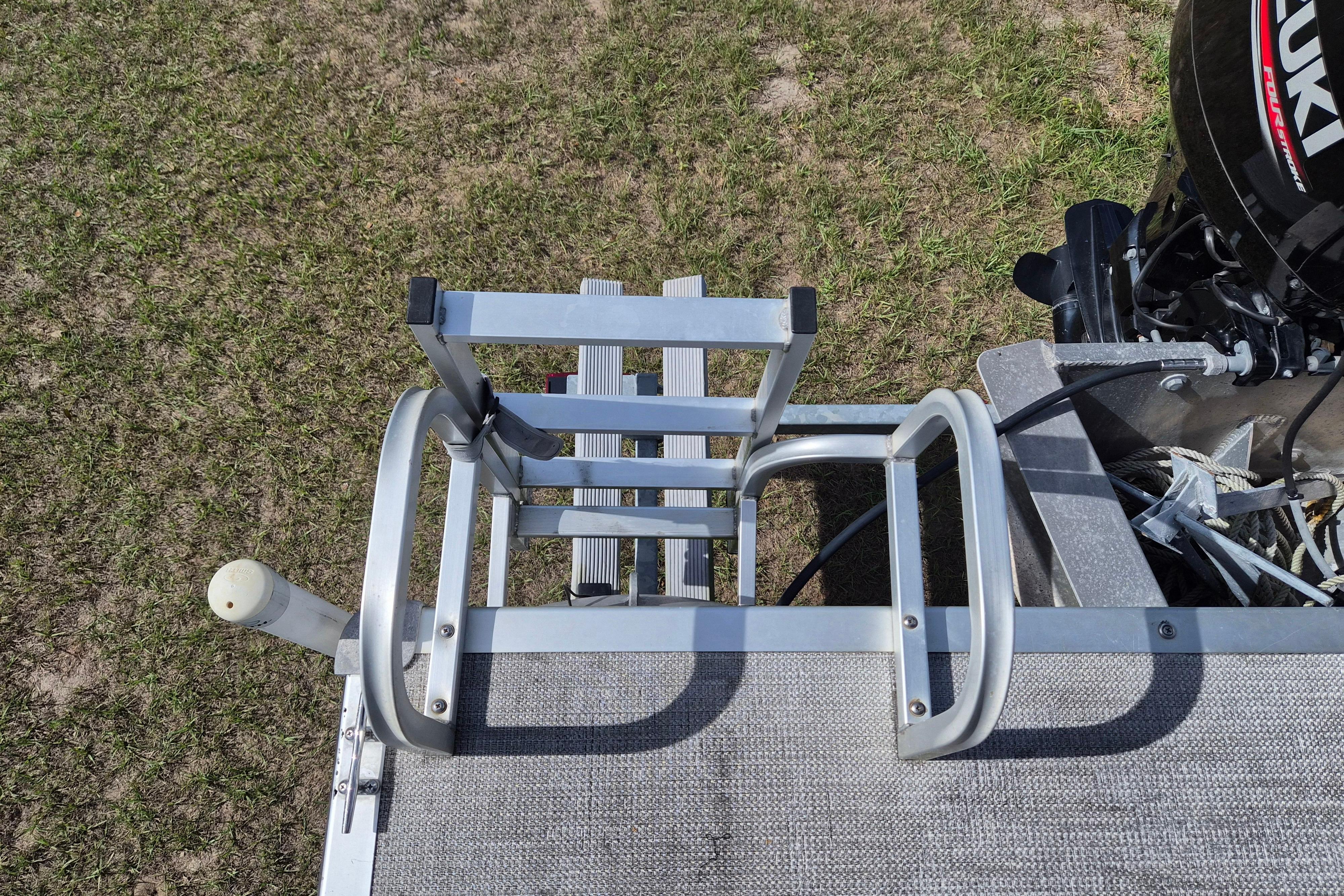 Aluminum ladder on 2004 Bentley Pontoons 180 CRUISE, with Suzuki outboard motor.