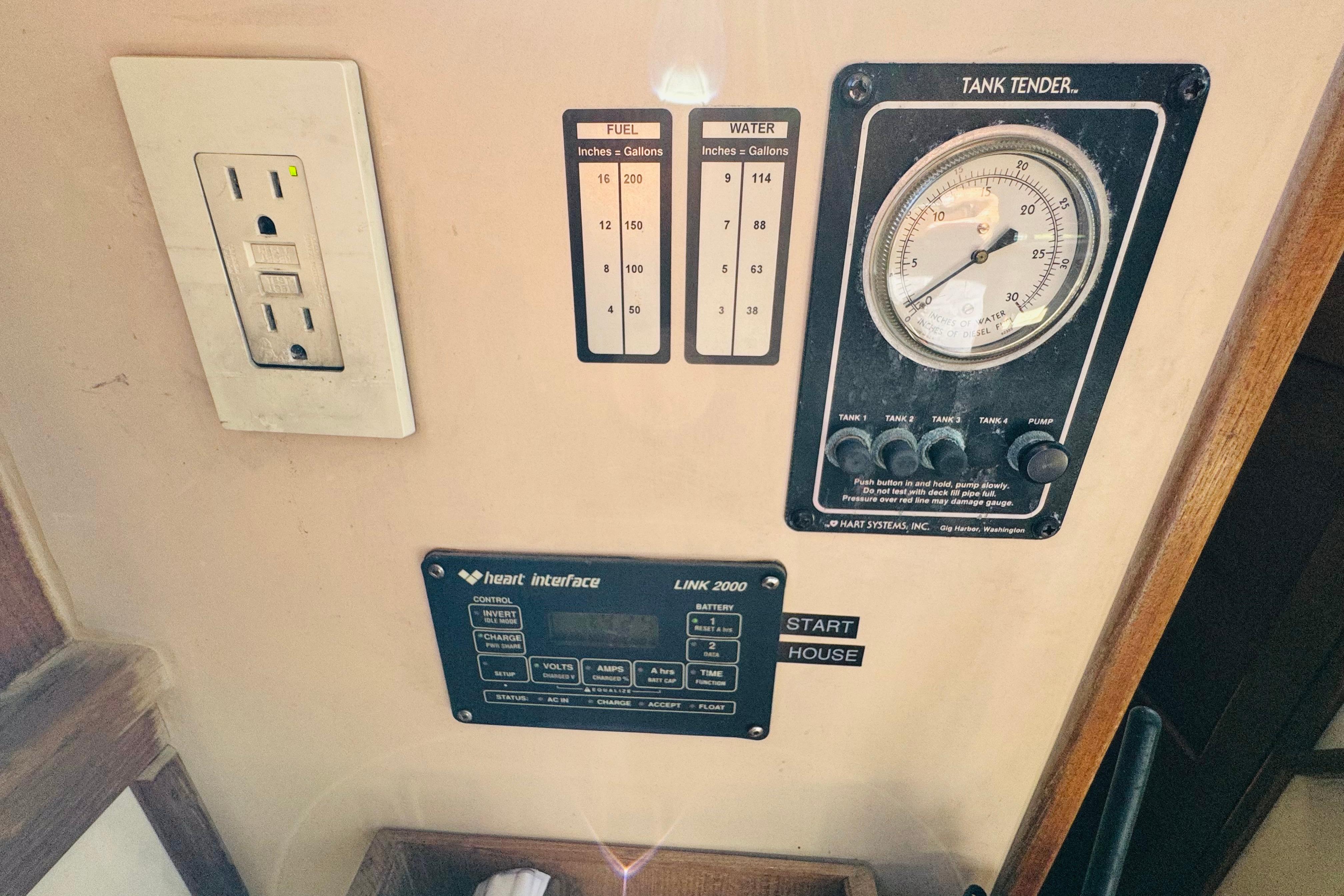 Control panel of a 1996 Nordic Tug 32 with fuel and water gauges.