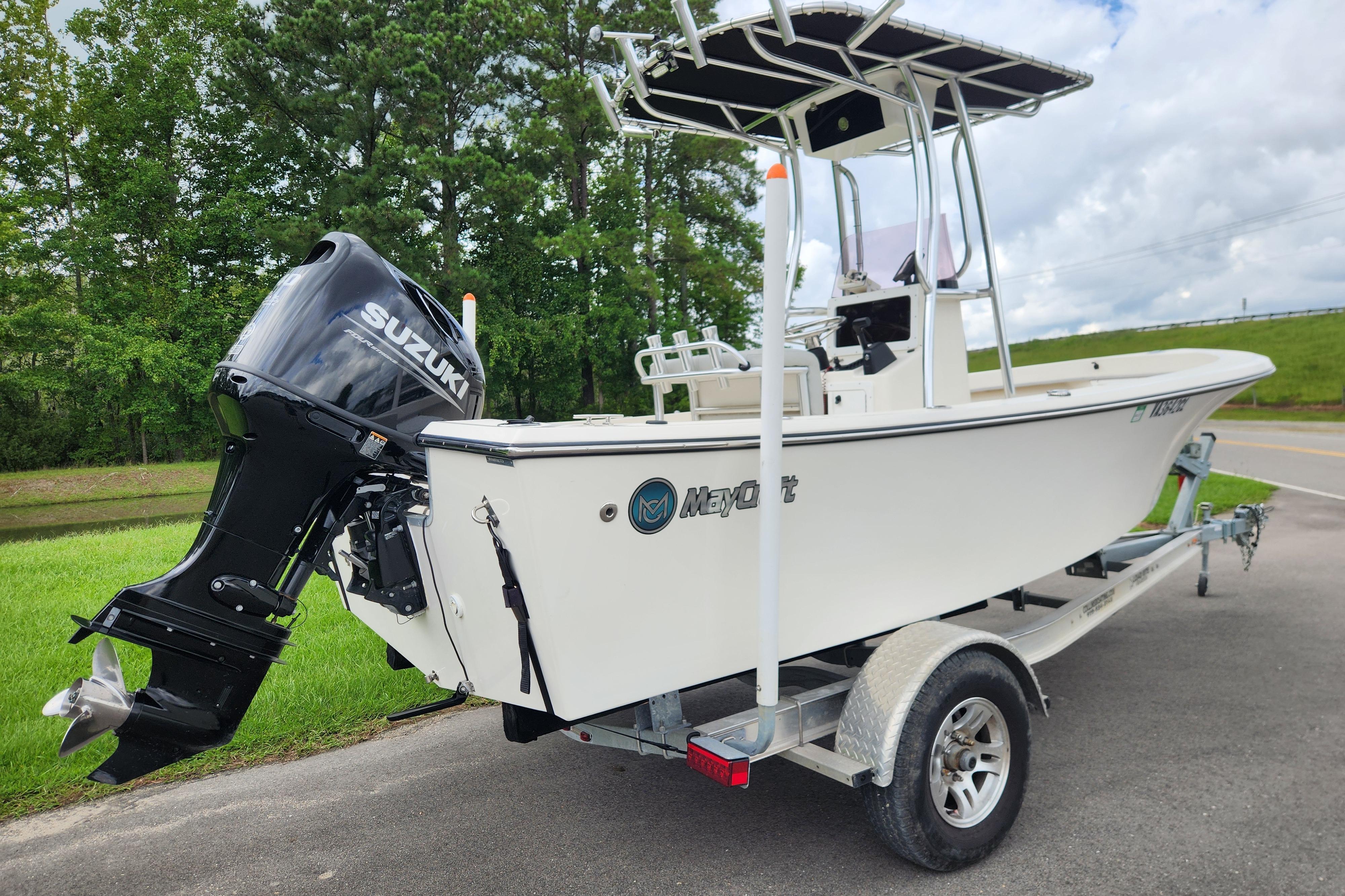 2023 May-Craft 1900CC boat on trailer with Suzuki outboard motor.