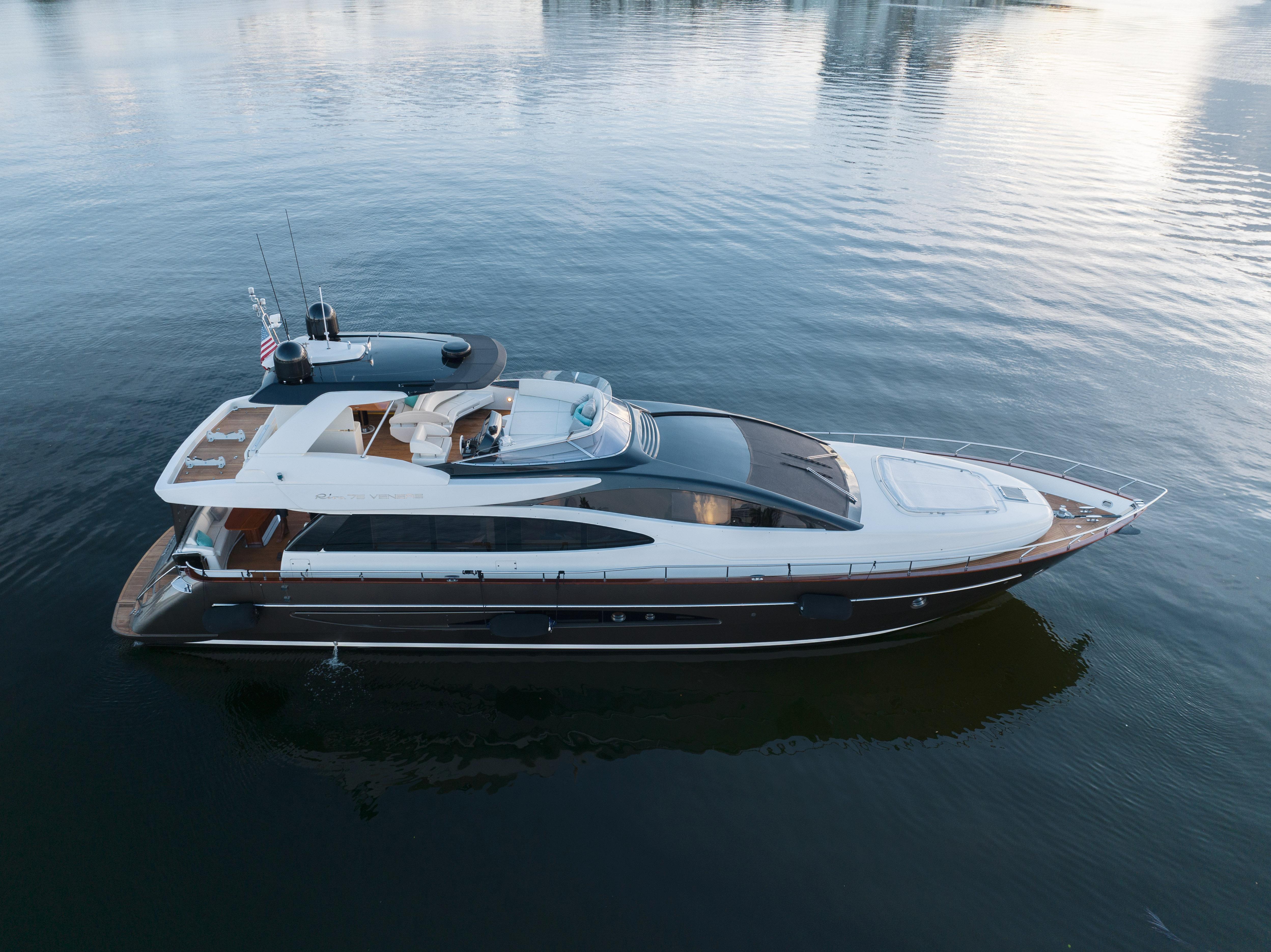 2012 Riva 75 Venere luxury yacht cruising on calm waters.