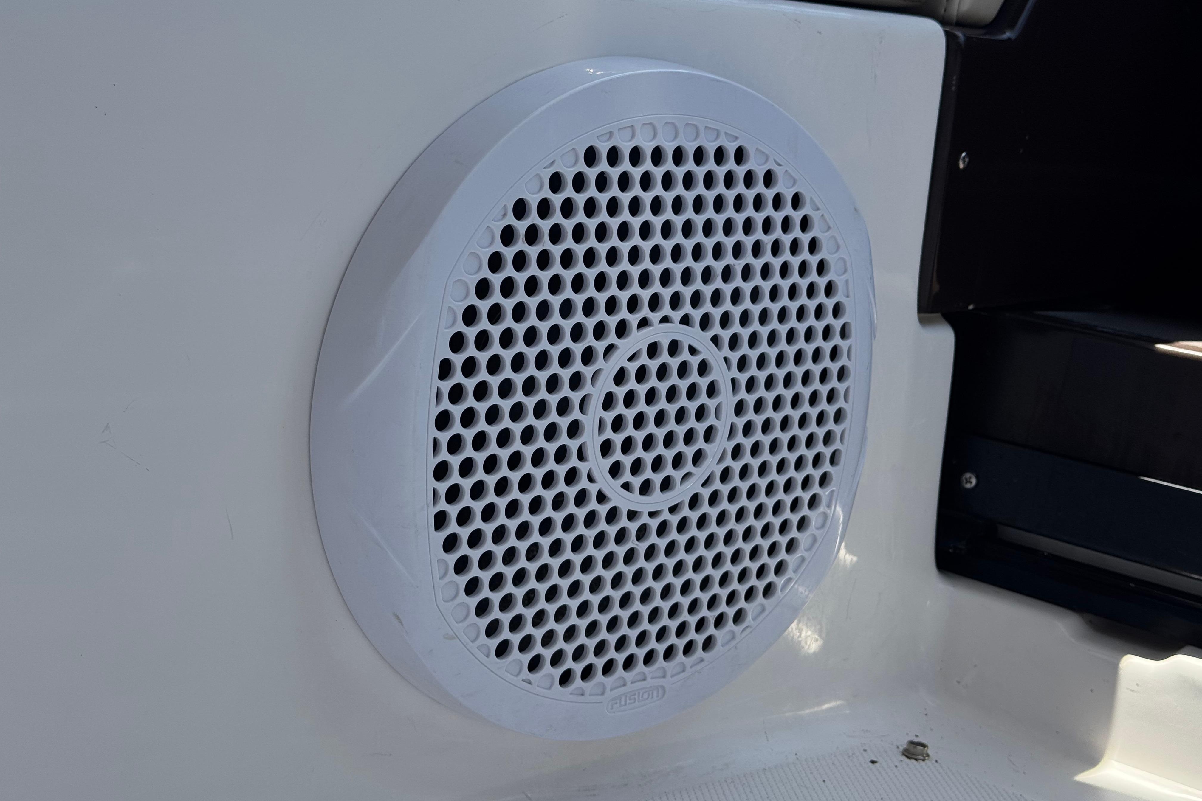 White speaker grille on a 2013 Regal 28 Express boat interior.