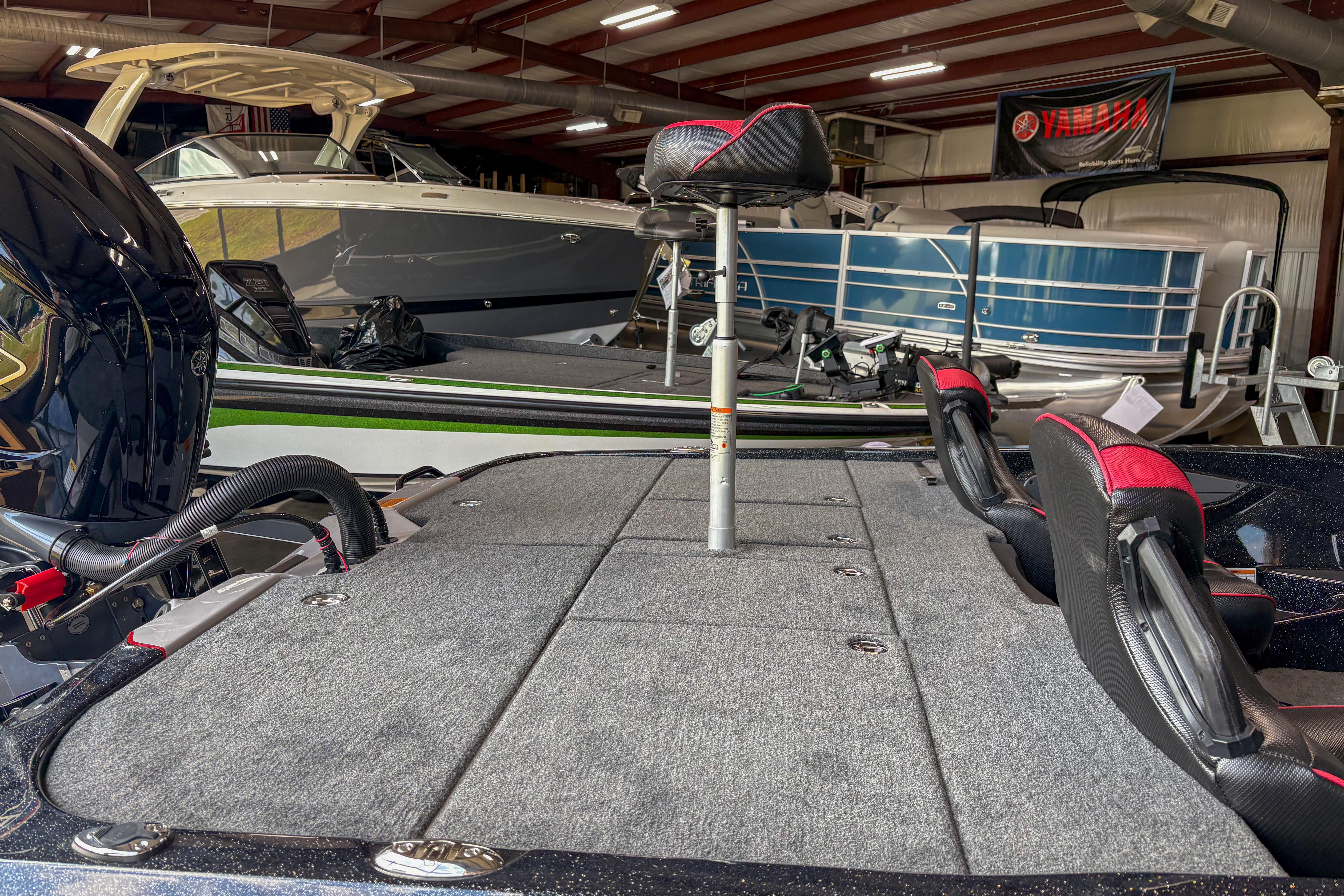 2026 Skeeter ZXE20 boat in showroom, featuring spacious deck and seating.