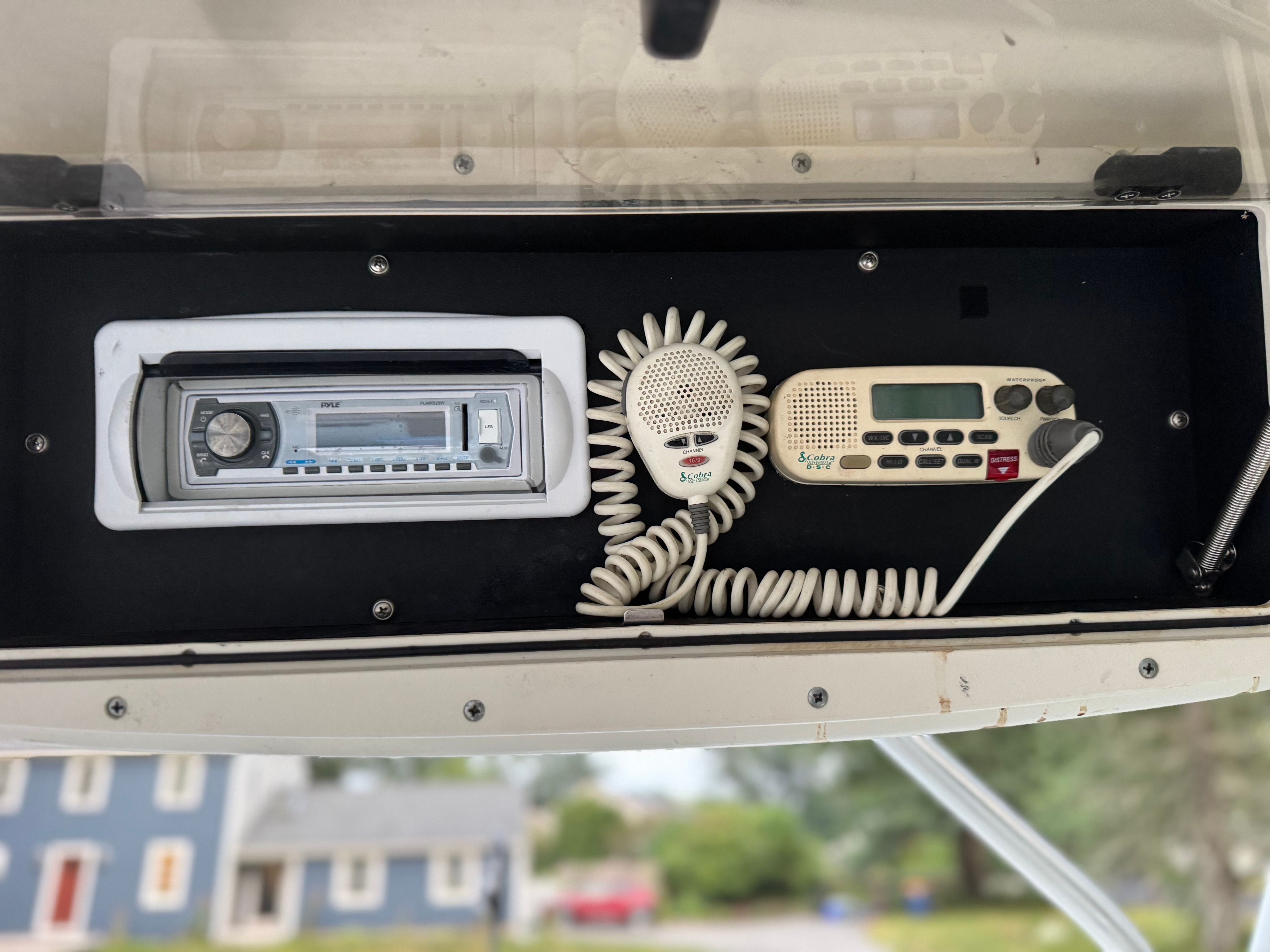 Boat console with radio and communication device, Boston Whaler Conquest 2000.
