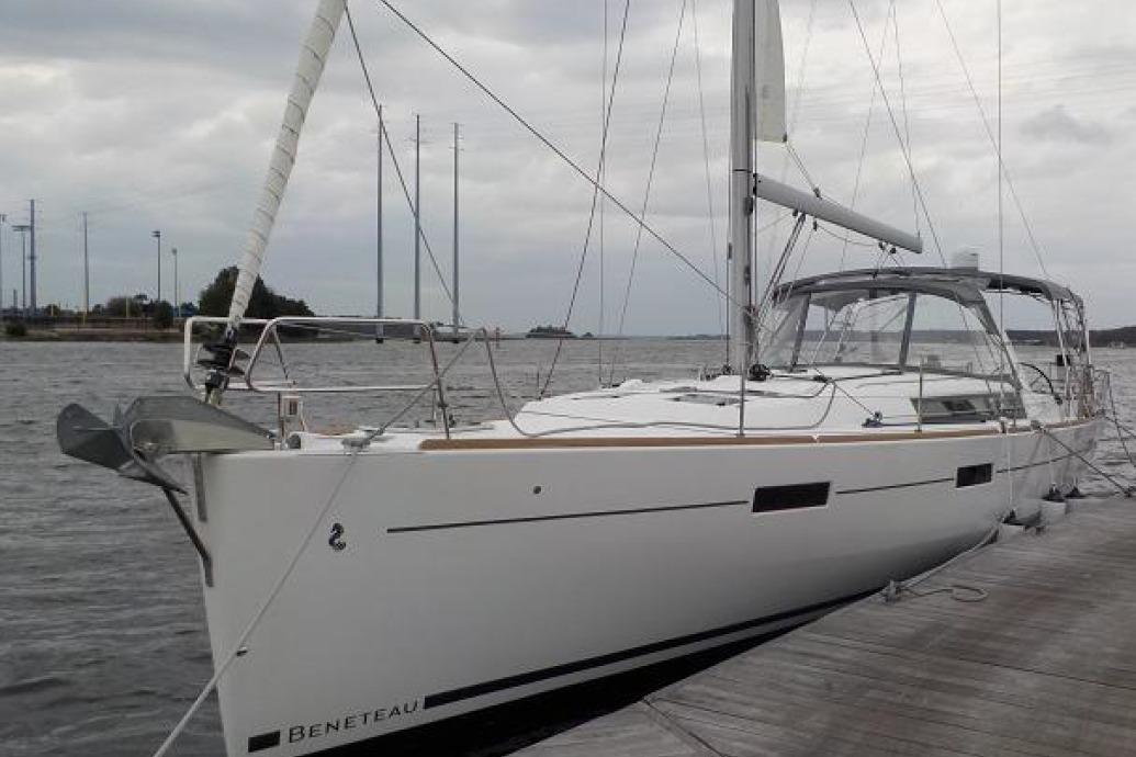 2017 Beneteau Oceanis 45 sailboat docked on a cloudy day.