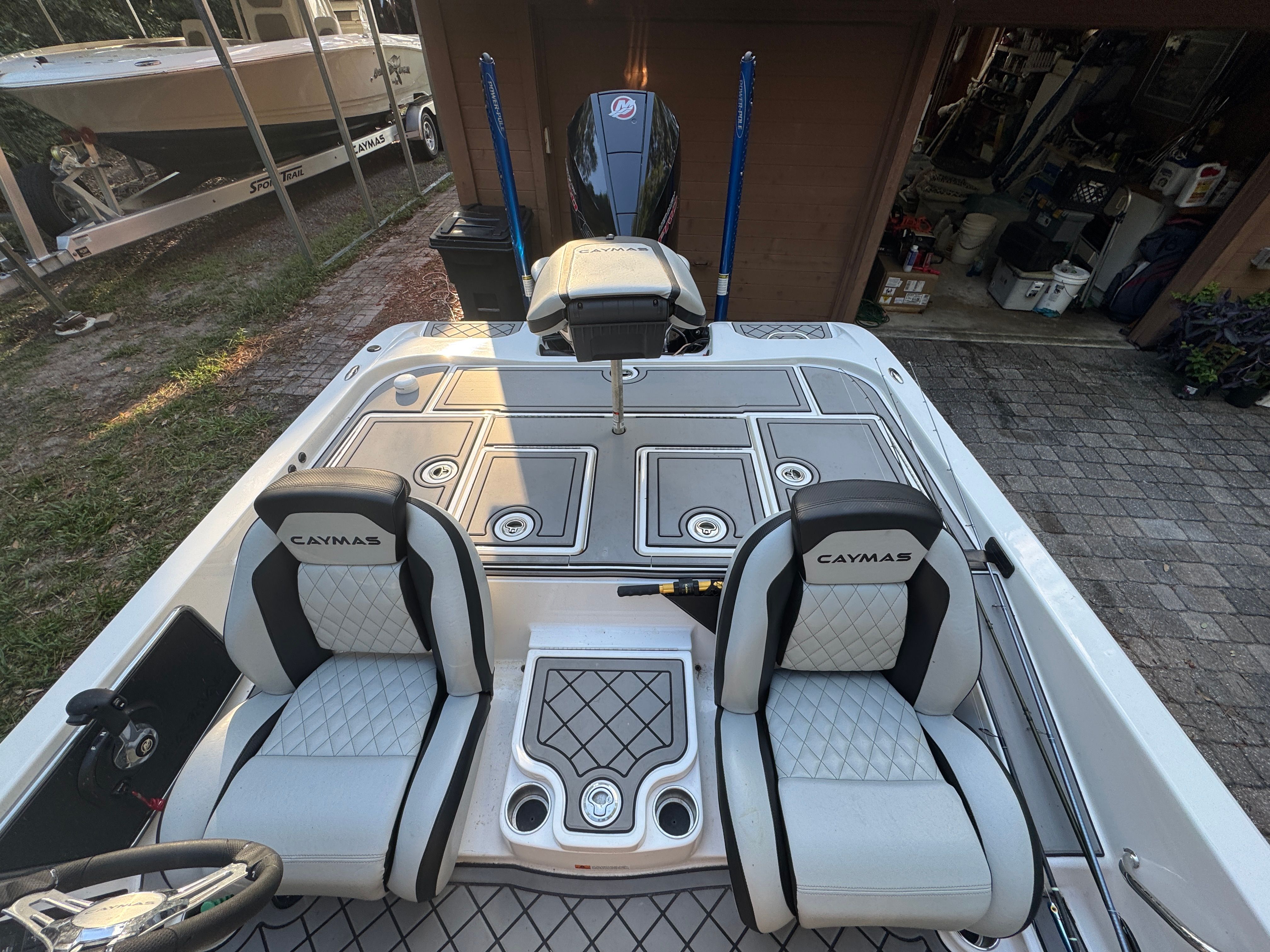 The image shows the cockpit of a 2025 Caymas CS-20 boat with two cushioned seats.