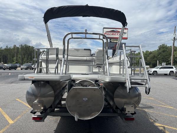 2025 Godfrey SWEETWATER 2286 SFL pontoon boat, rear view, parked outdoors.