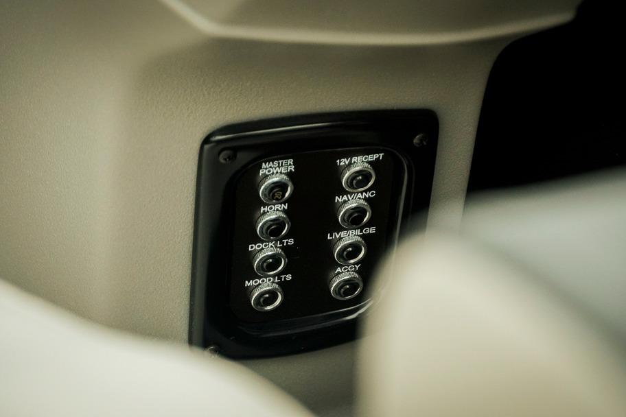 Control panel of Dockside 20DQ 2026 boat with labeled switches.
