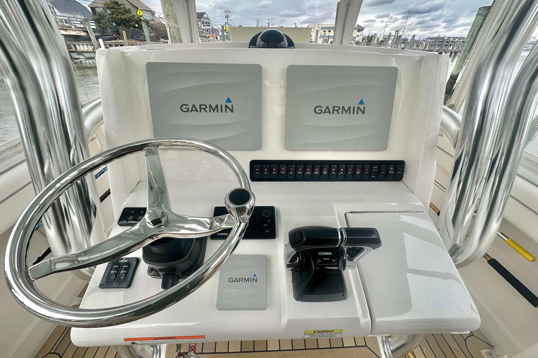 2013 Jupiter 30 Center Console helm with Garmin displays and controls.