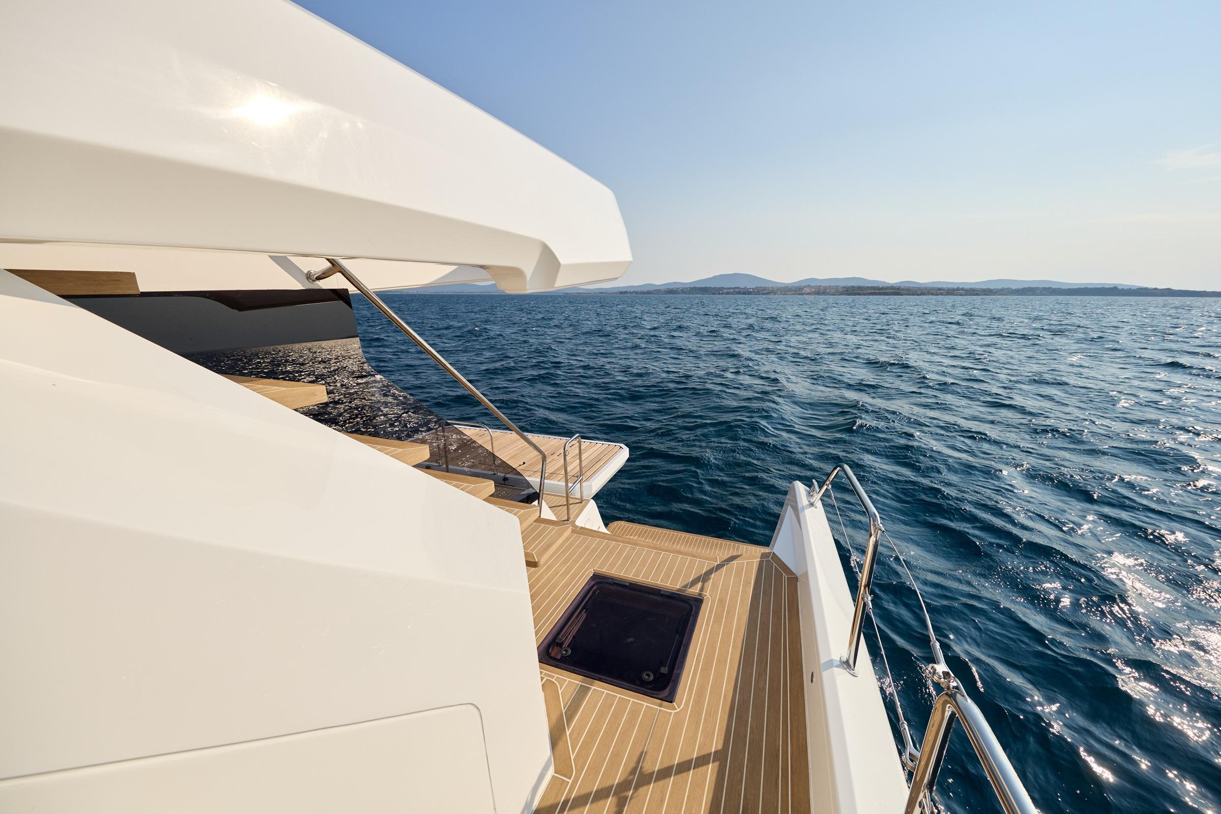2025 Custom Omaya 50 Power Catamaran deck overlooking serene ocean view.