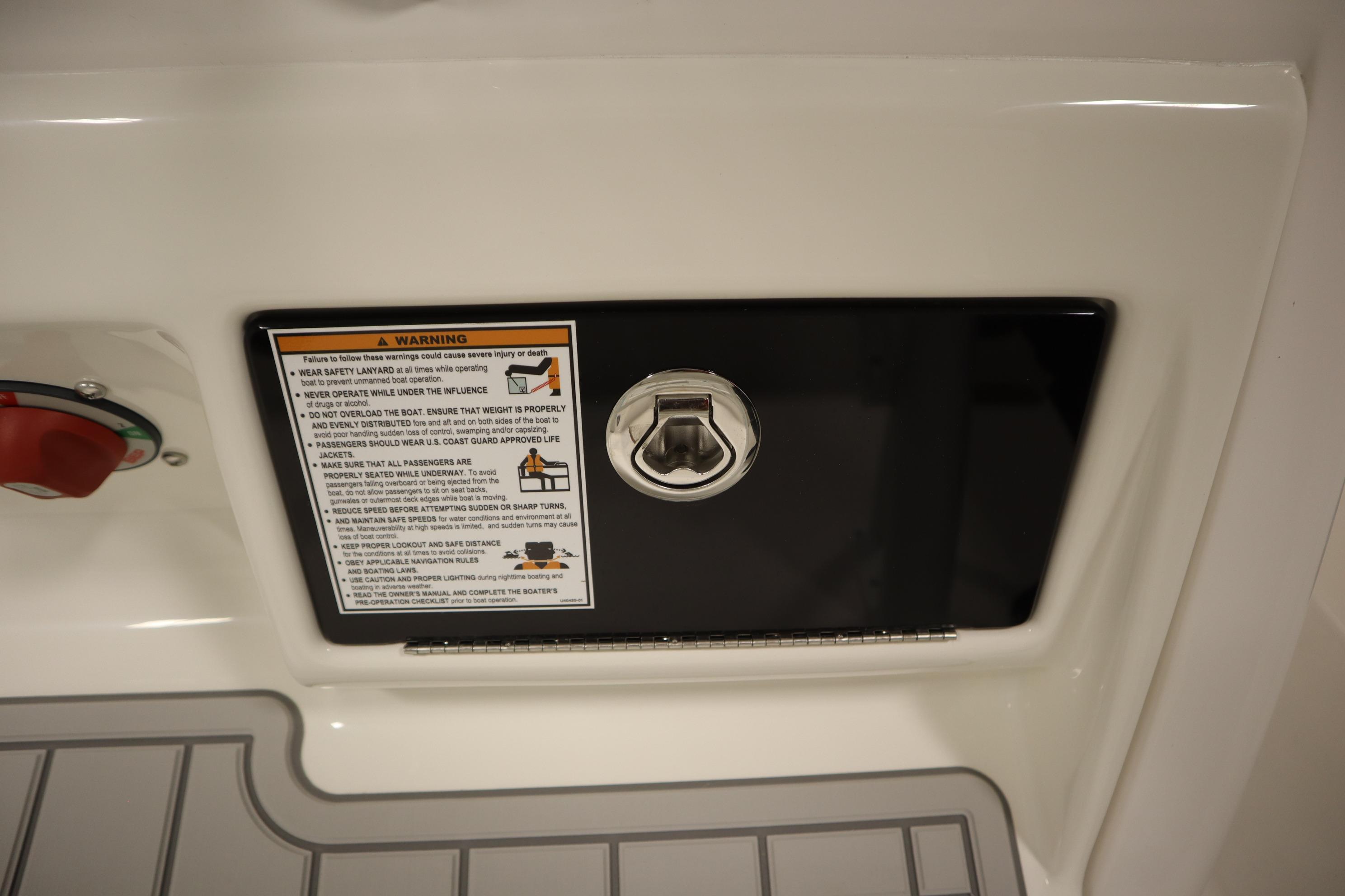 2026 Sea Fox 228 Commander boat warning label and hatch detail.