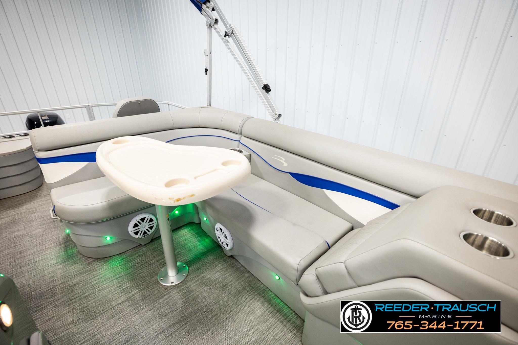 2021 Bennington 20 SV pontoon boat interior with seating and table, featuring modern design.