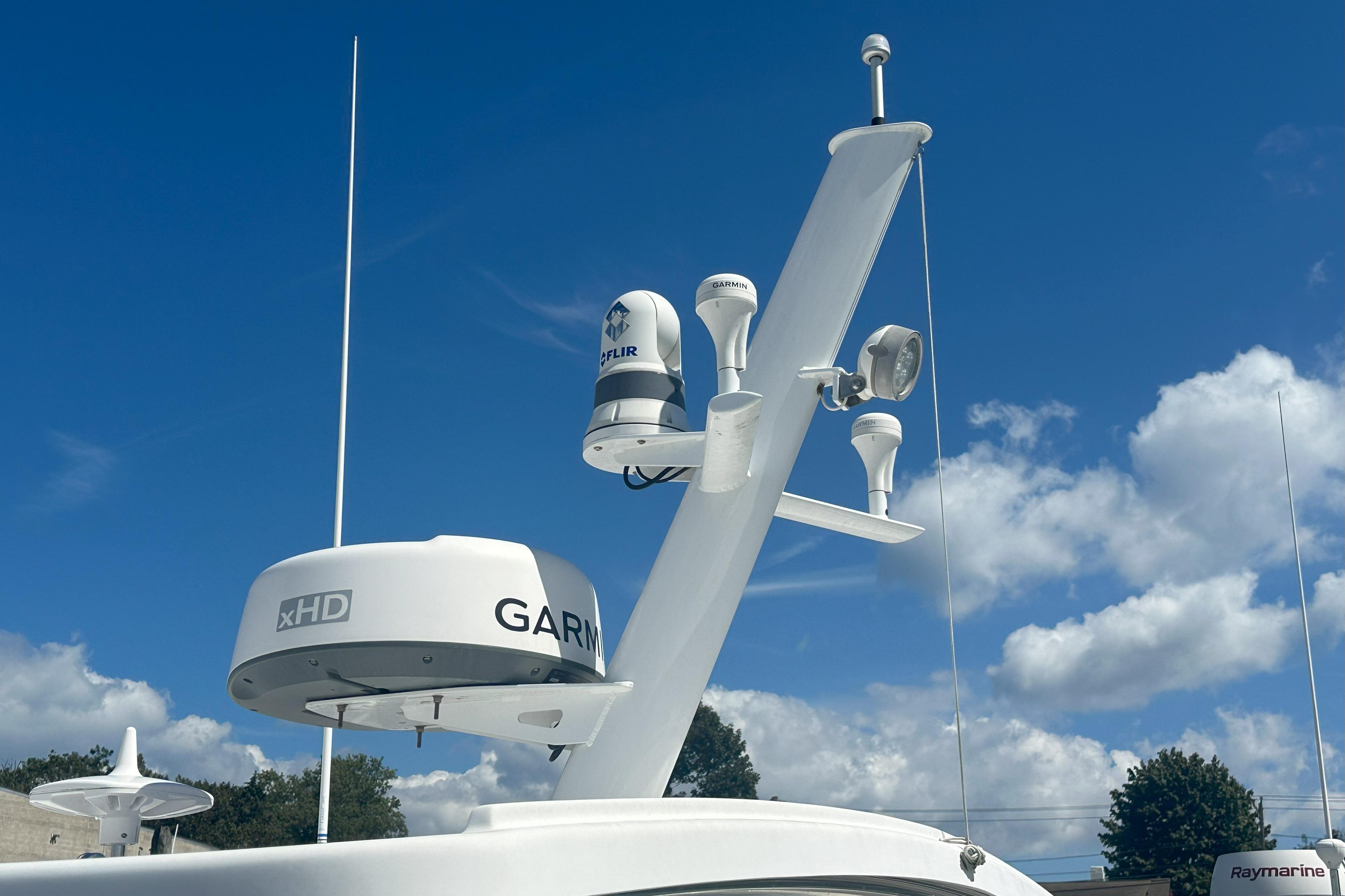 2017 Fortier F-30 Hardtop with Garmin xHD radar and FLIR camera under blue sky.