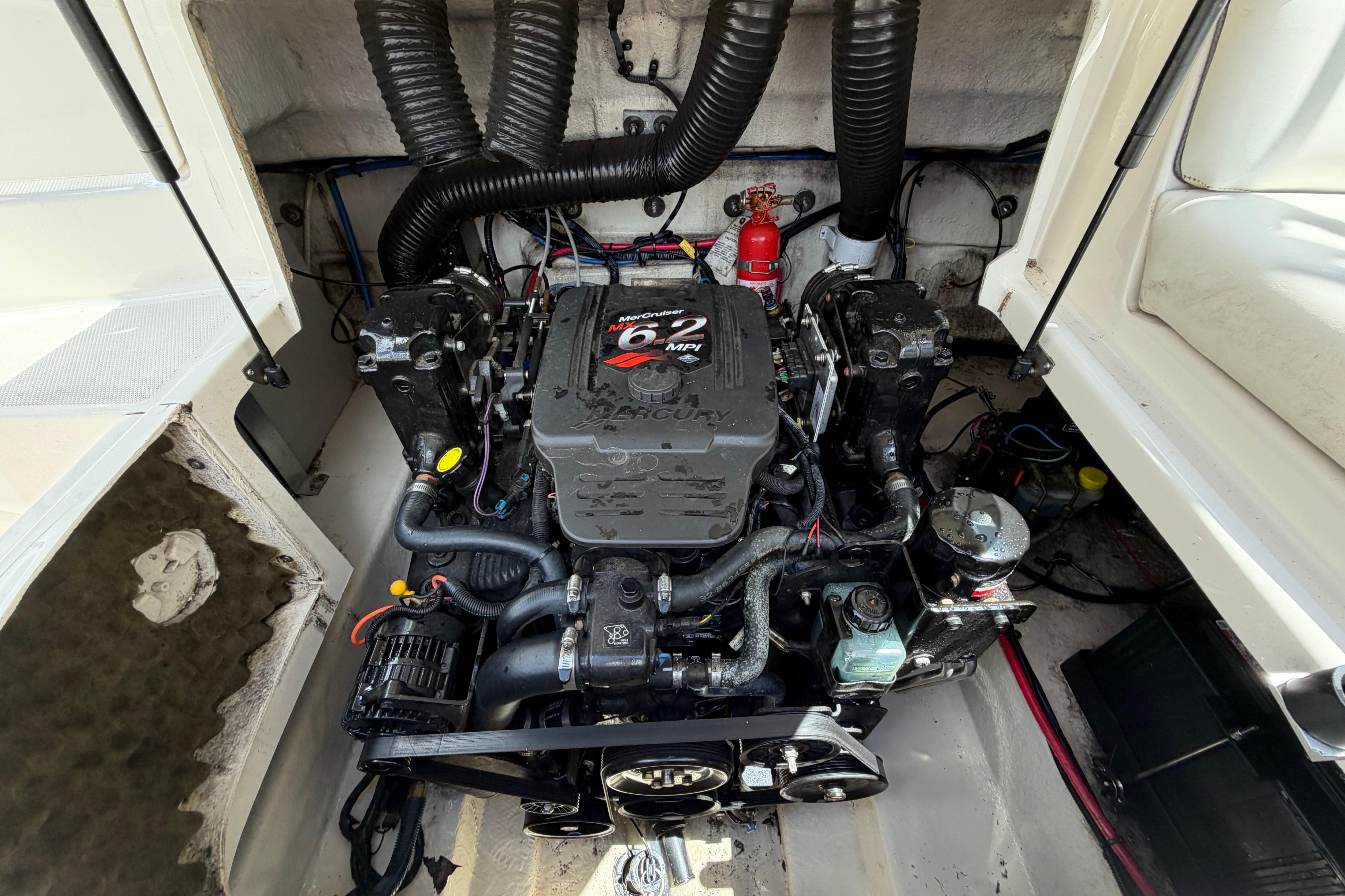 Engine compartment of a 2004 Sea Ray 240 Sundeck with MerCruiser 6.2 MPI engine.