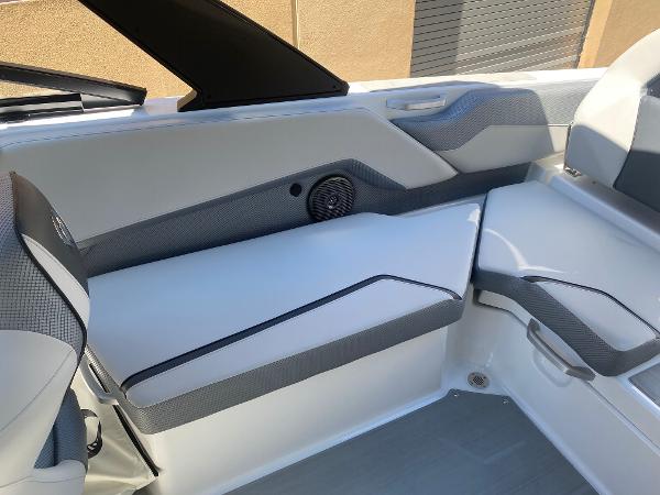 Interior of 2025 Scarab 235 SE boat, featuring sleek seating and modern design.