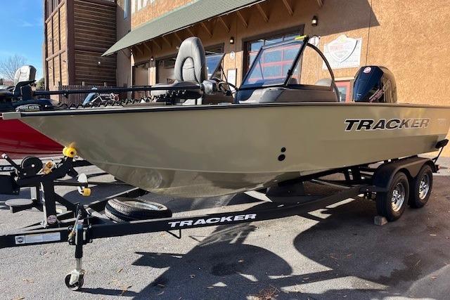 2026 Tracker Targa V-18 Combo boat on trailer, parked outdoors.