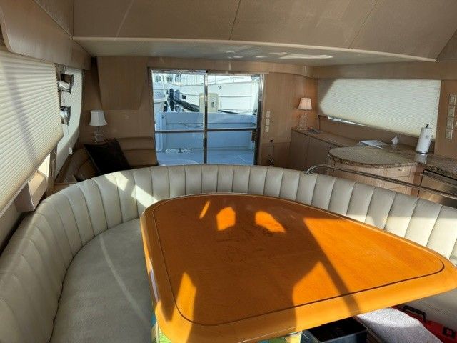 Interior of a 1990 custom motor yacht with elegant seating area.