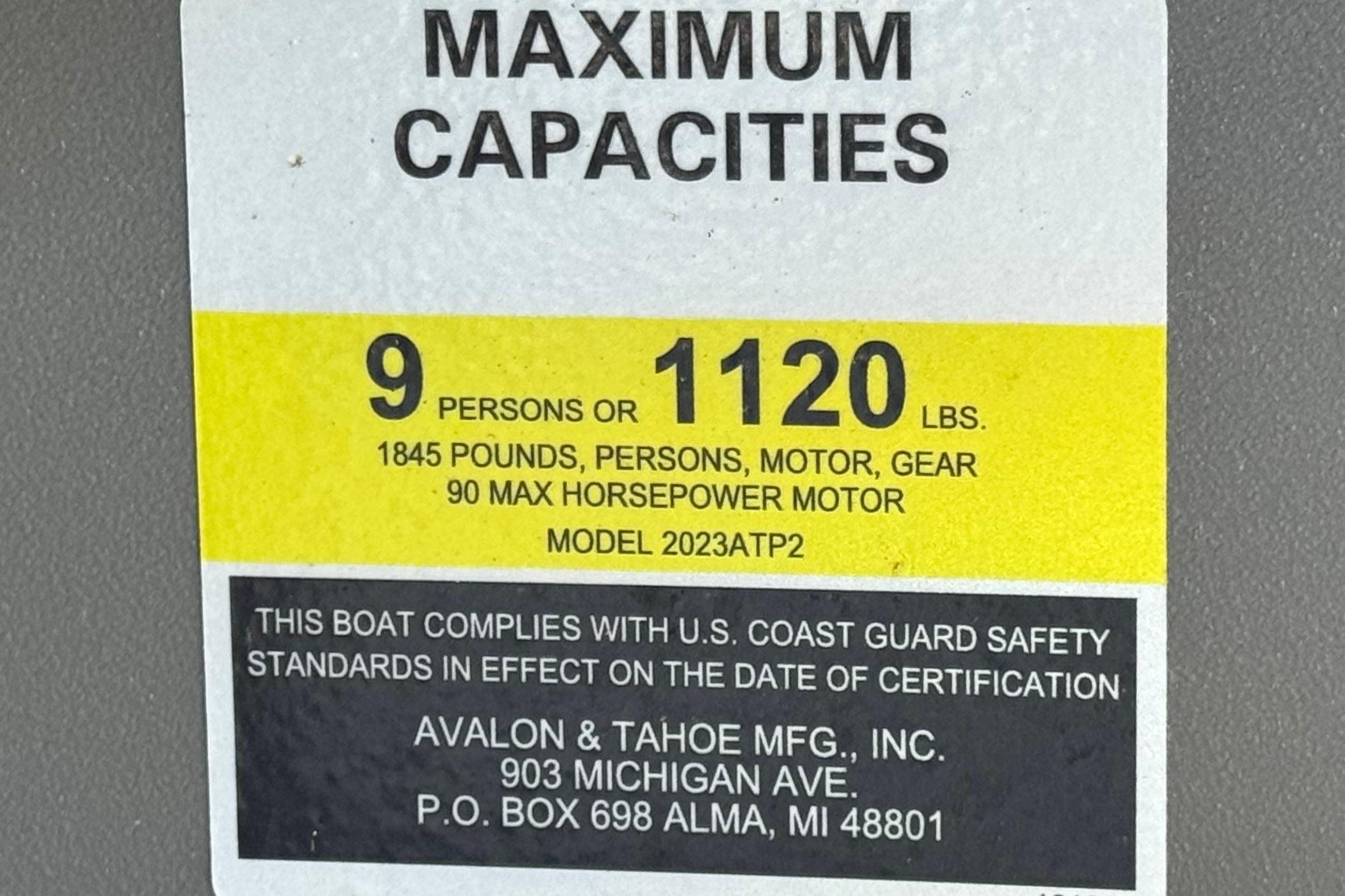 2023 Avalon Venture Fish N Cruise boat capacity label, 9 persons or 1120 lbs, USCG compliant.