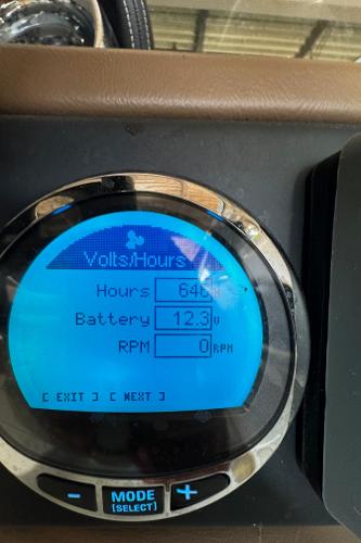 Digital display on 2023 Crownline 215 XS showing battery voltage and engine hours.