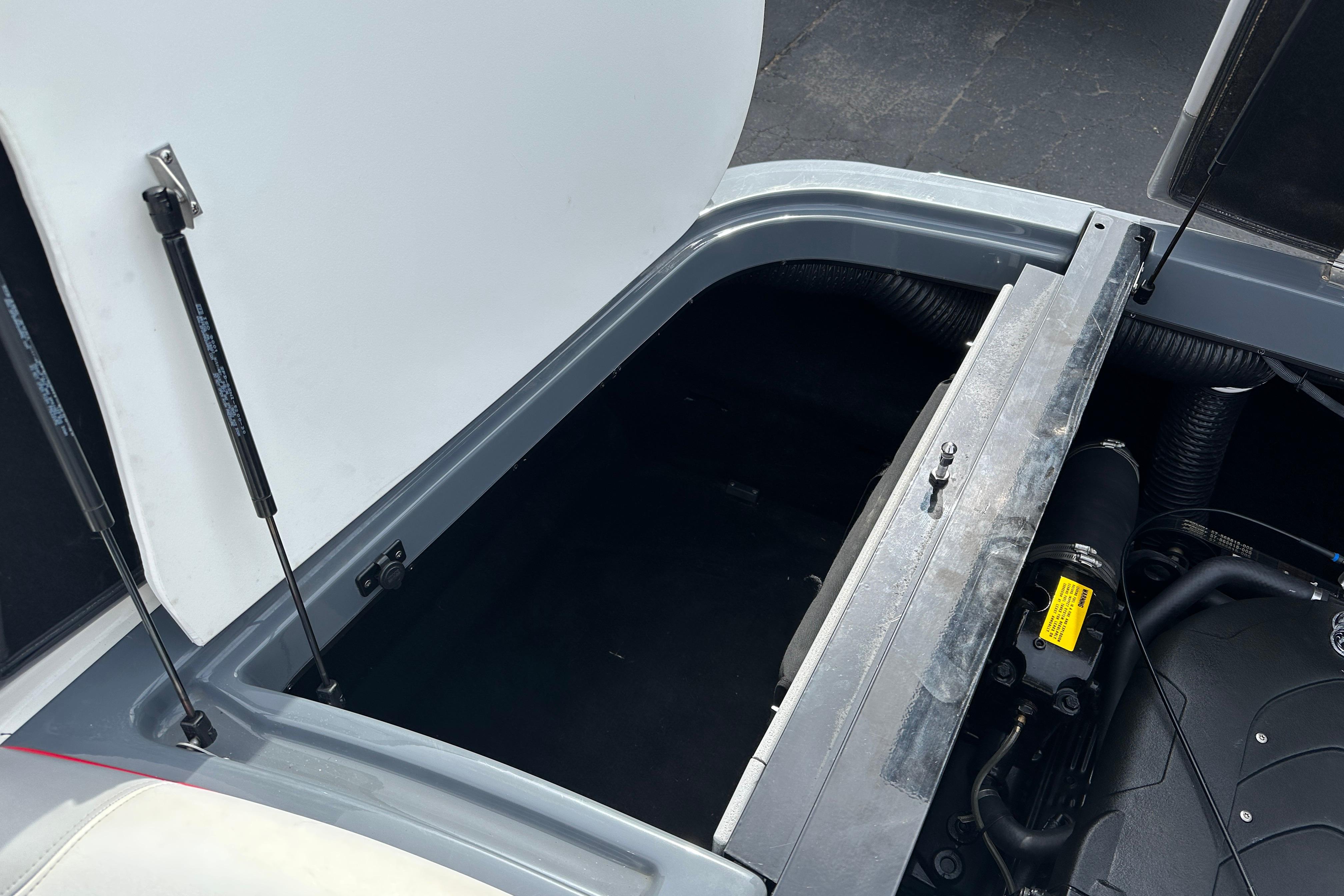 Open engine compartment of 2008 Centurion Enzo SV240 boat, showcasing interior components.