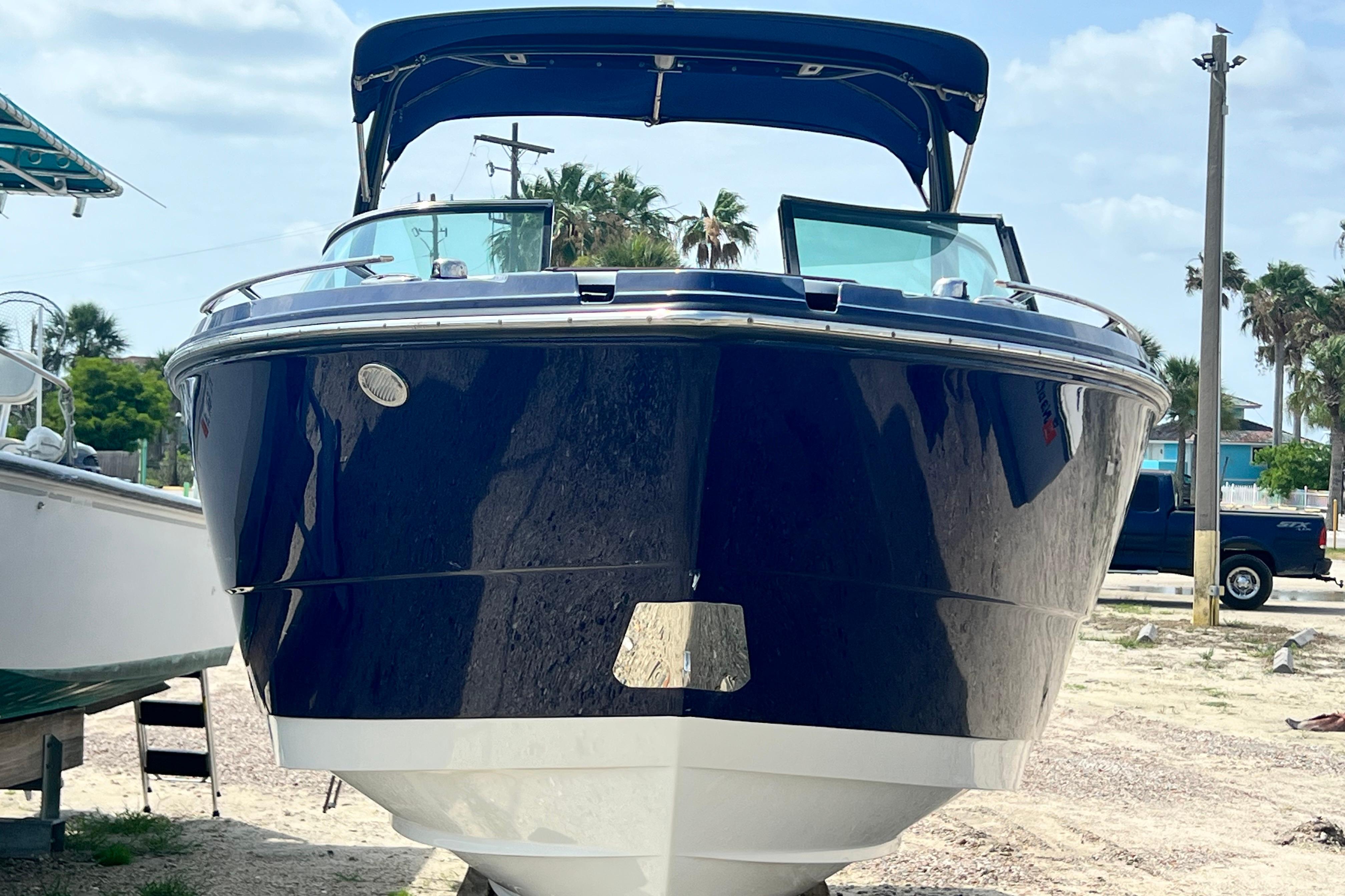 2015 Monterey 268SS Super Sport boat on display, featuring sleek design and blue hull.