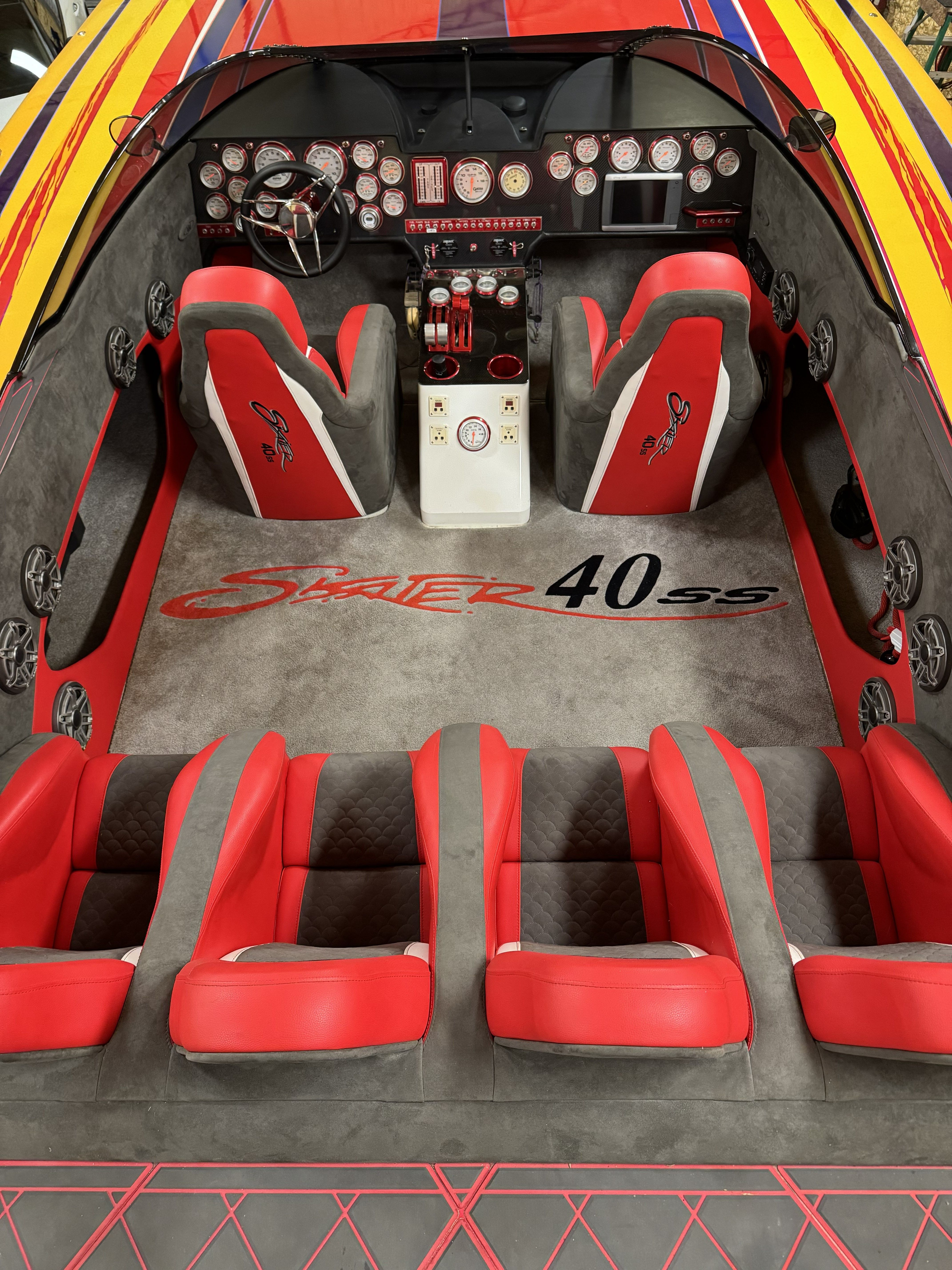 Interior of a 2003 Skater 40 S.S. with red seats and dashboard.