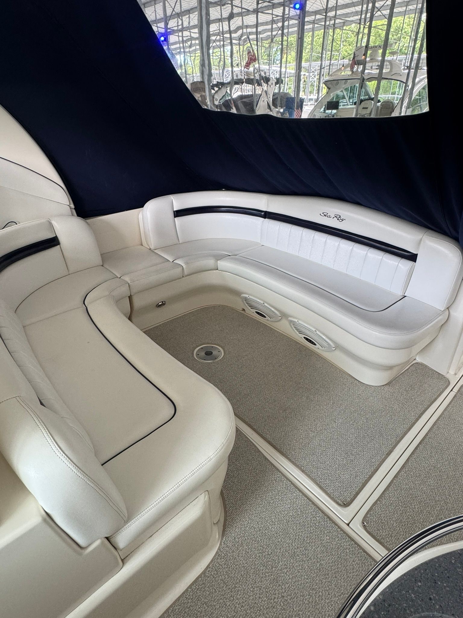 Interior of a 2007 Sea Ray 40 Sundancer with white leather seating.