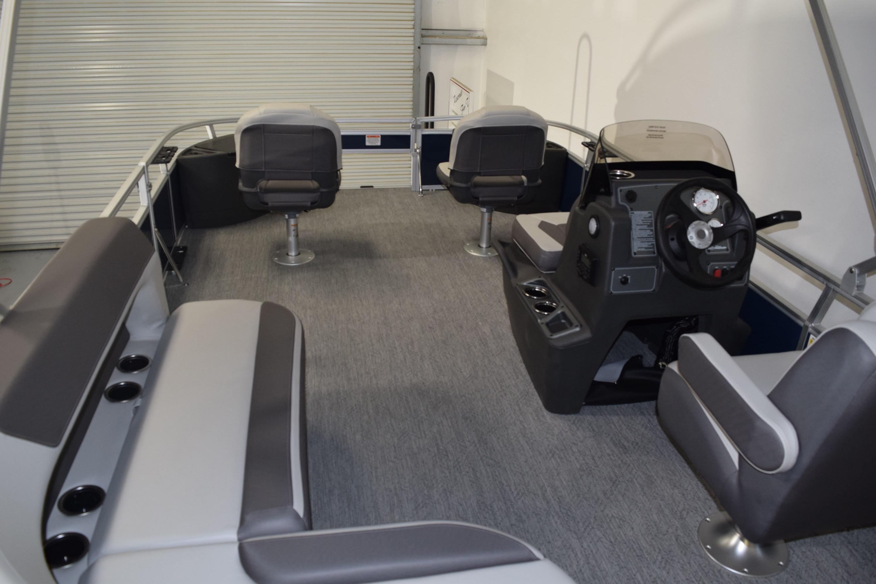 2026 Sun Tracker Bass Buggy 18 DLX interior with seating and steering console.