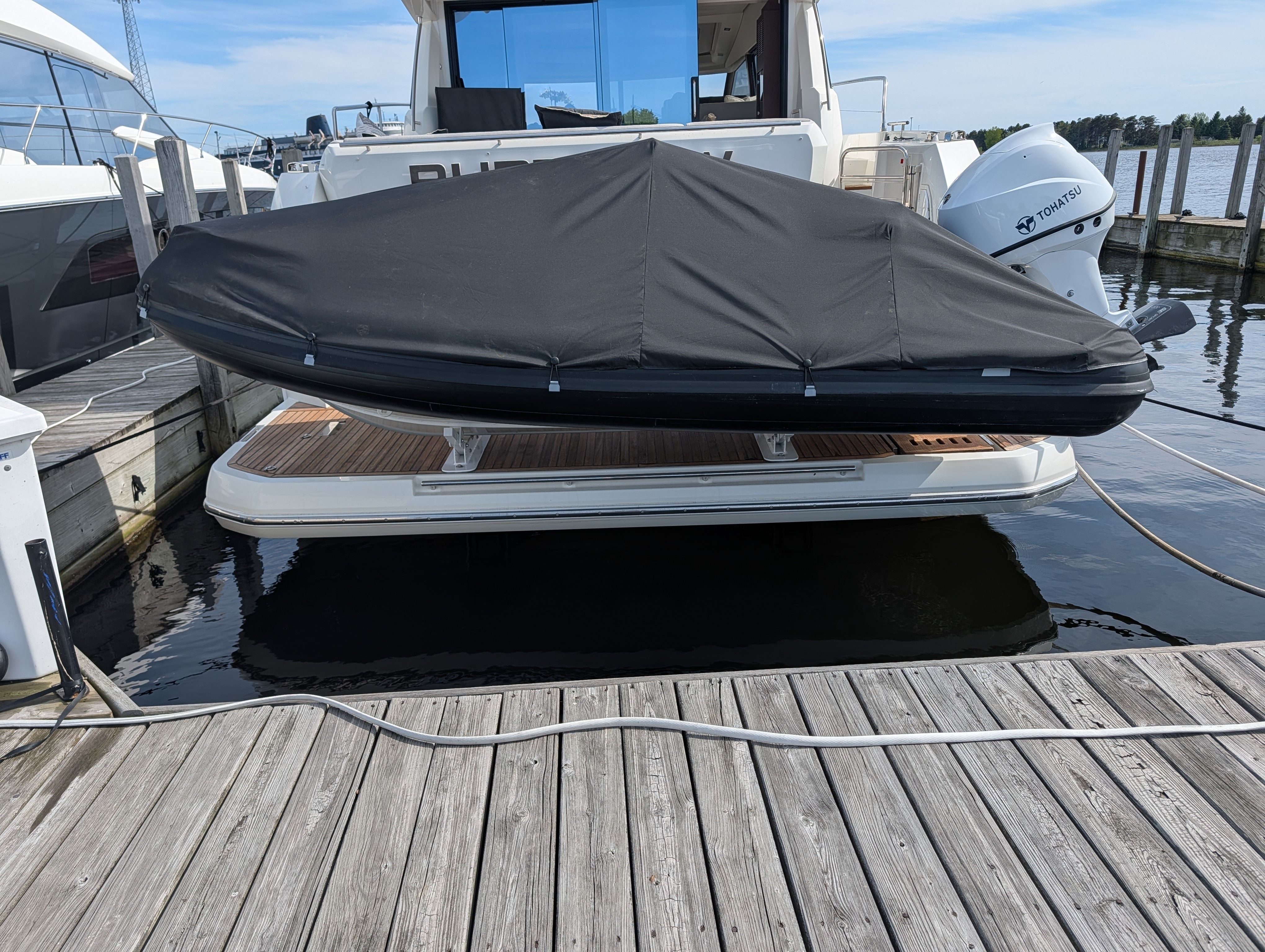 2024 Highfield Sport 390 covered on yacht platform.