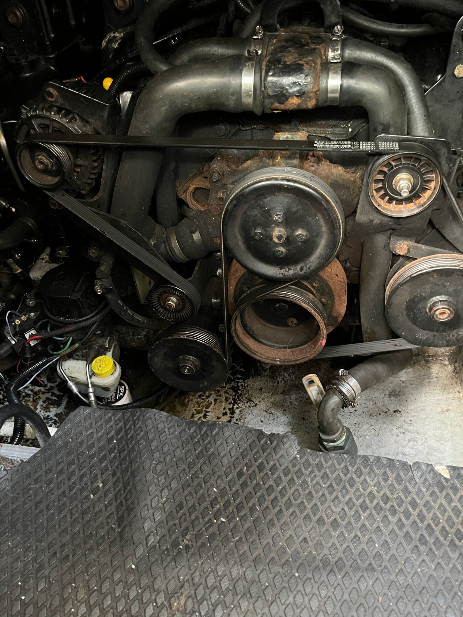 Engine compartment of a 2000 Chaparral Signature with pulleys and hoses.