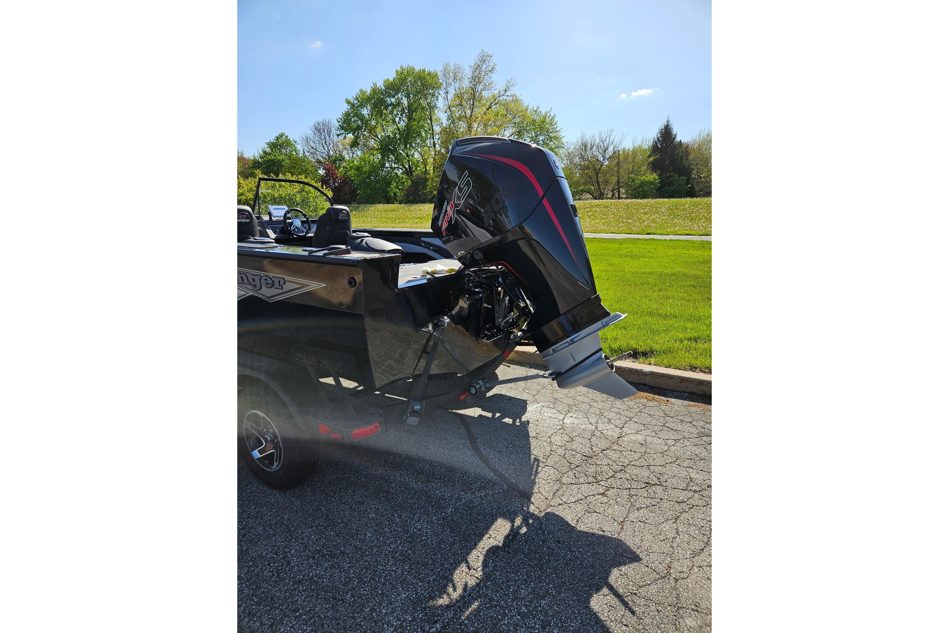 2026 Ranger VX1888 WT boat with powerful outboard motor on a sunny day.
