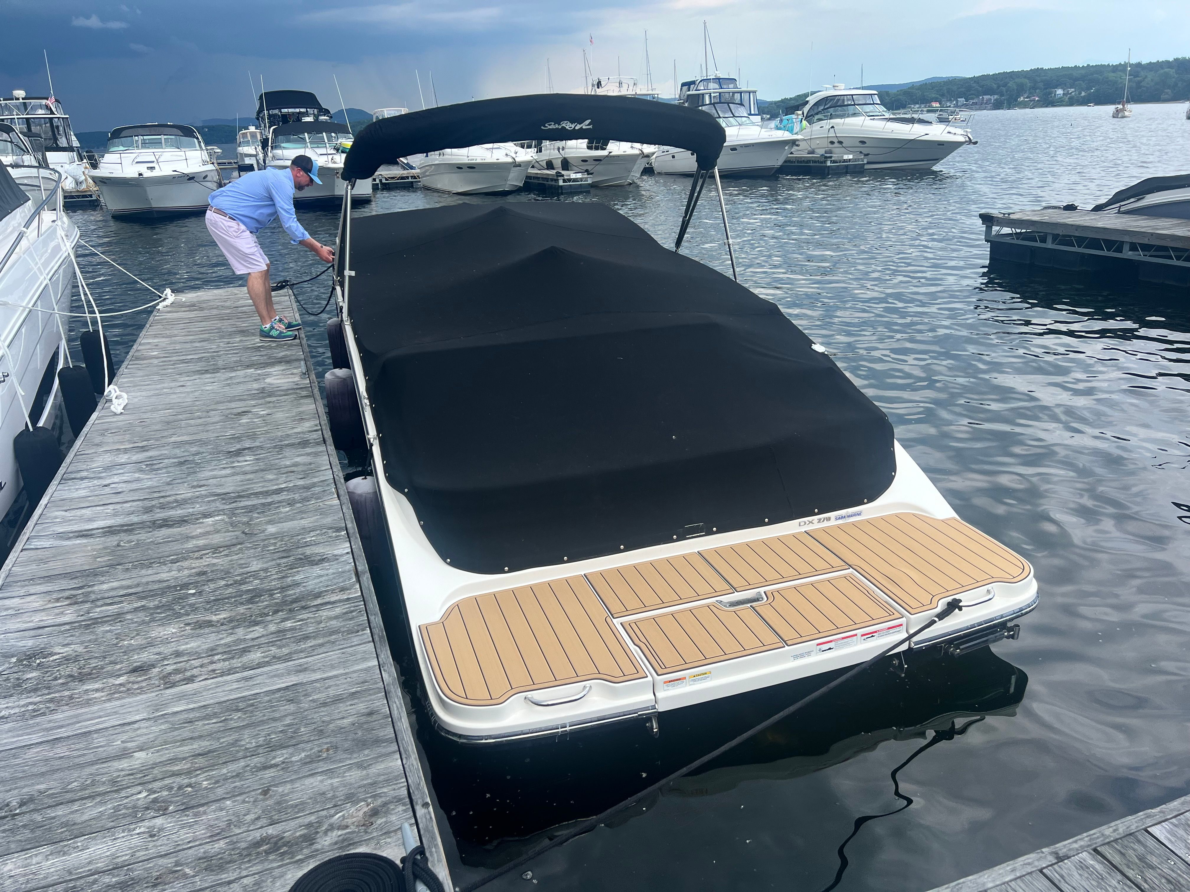 2018 Sea Ray SDX 270 docked with cover on.