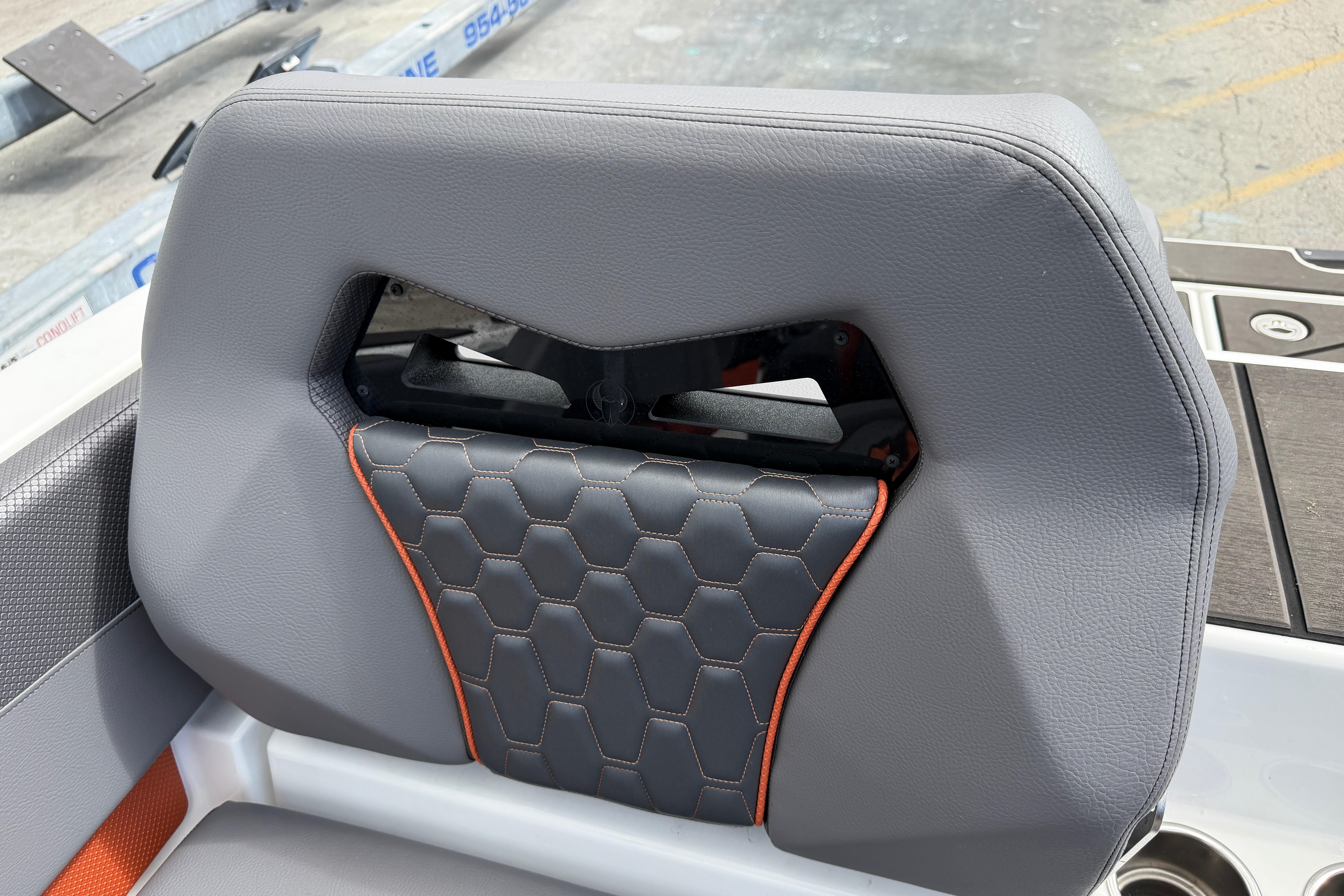 2026 Scarab 235 LX boat seat with hexagonal pattern and orange accents.