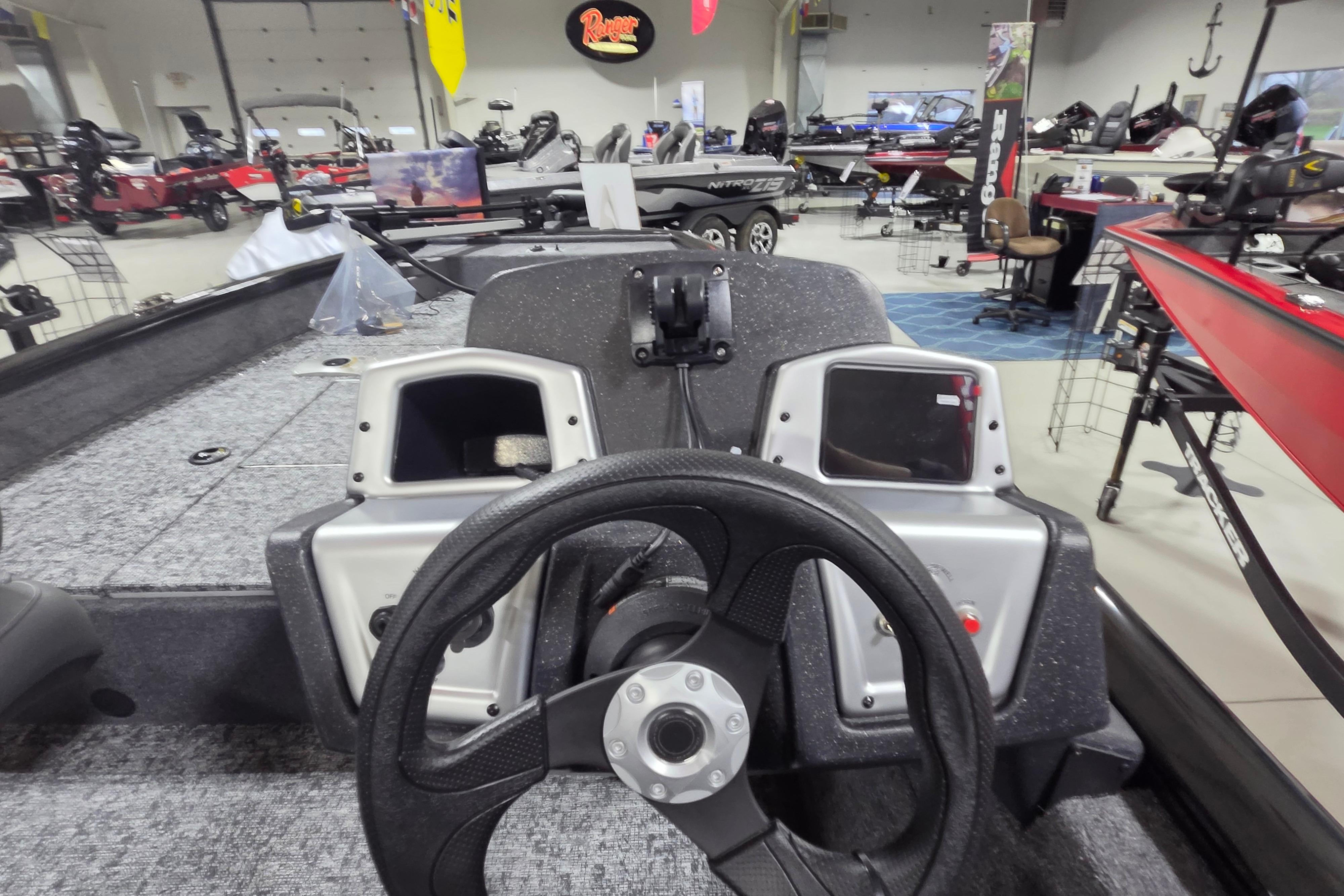 2026 Tracker Pro Team 175 Crappie Edition boat dashboard in showroom setting.