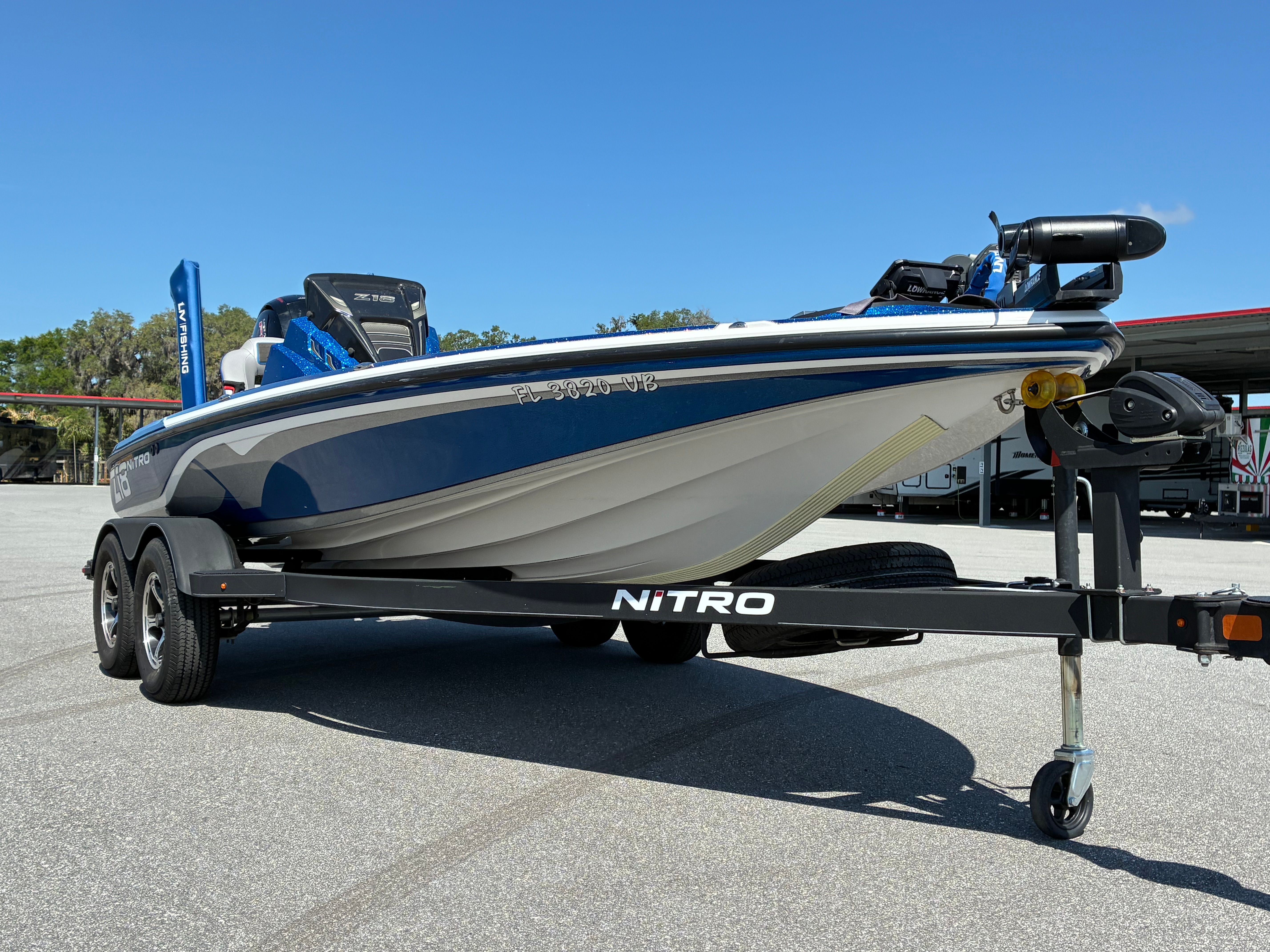 2024 Nitro Z18 Pro boat on trailer, blue sky.