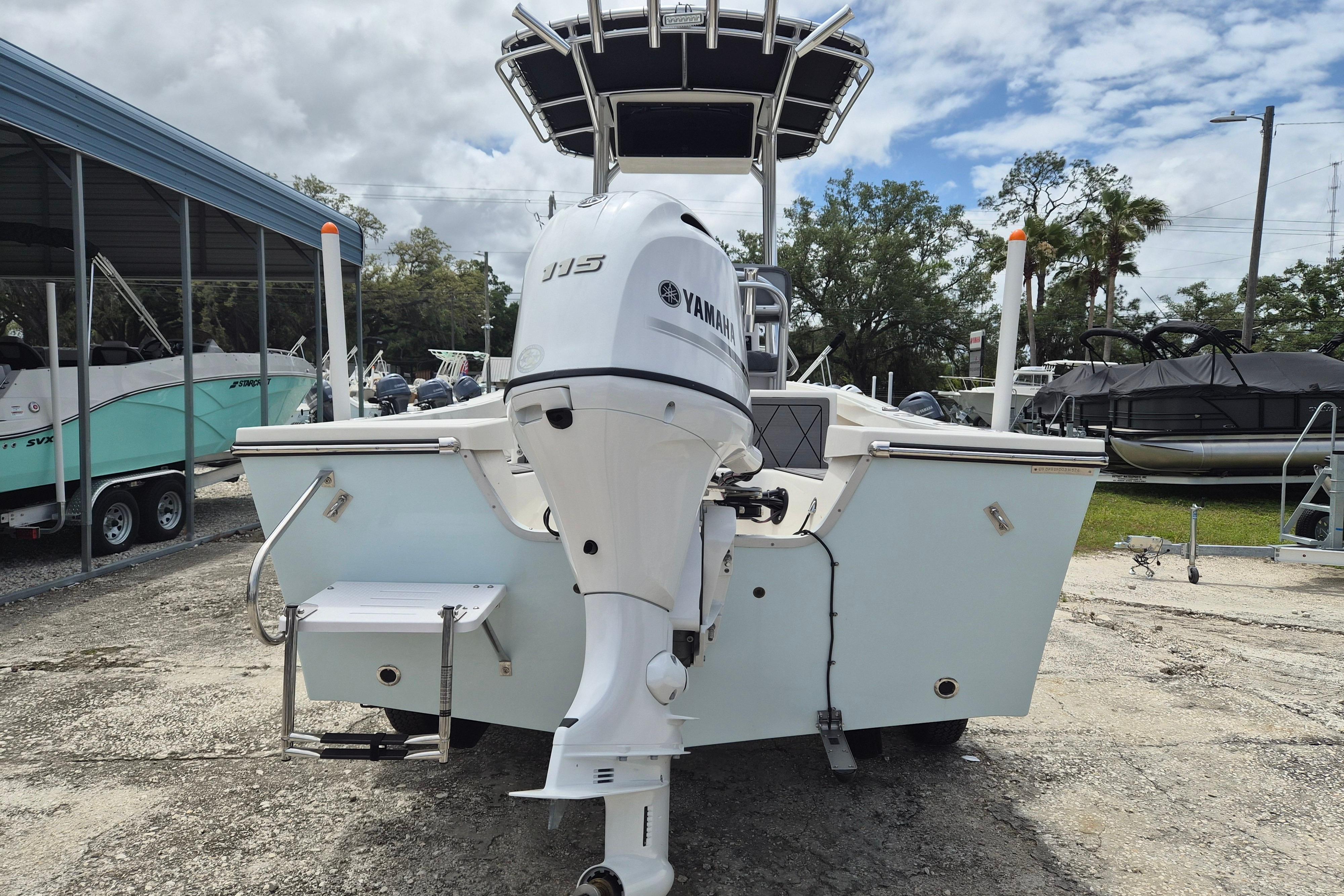 2026 Defiance Catalina 190 boat with Yamaha outboard motor, parked outdoors.
