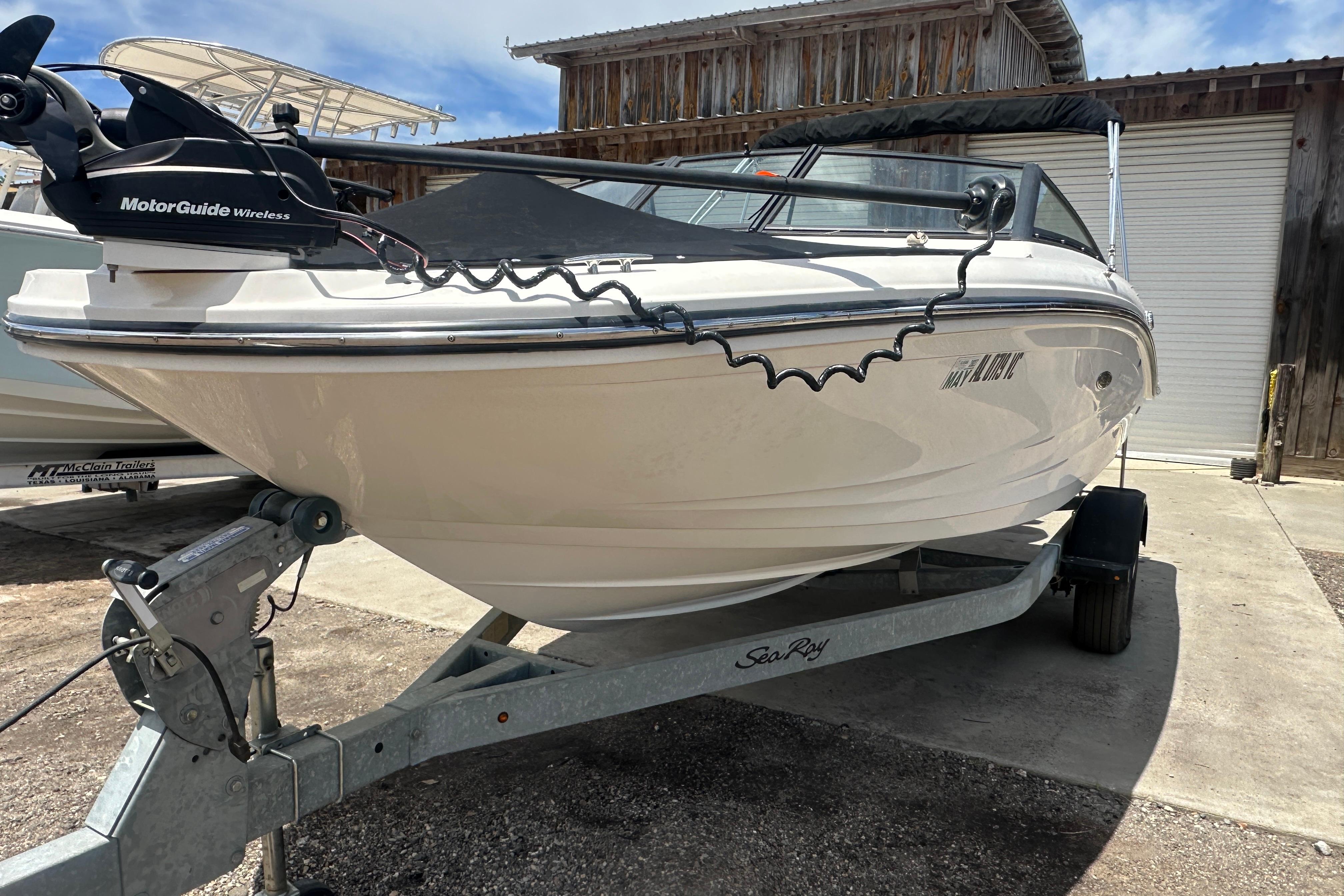 2017 Sea Ray SPX 190 Outboard boat on trailer, featuring MotorGuide wireless system.